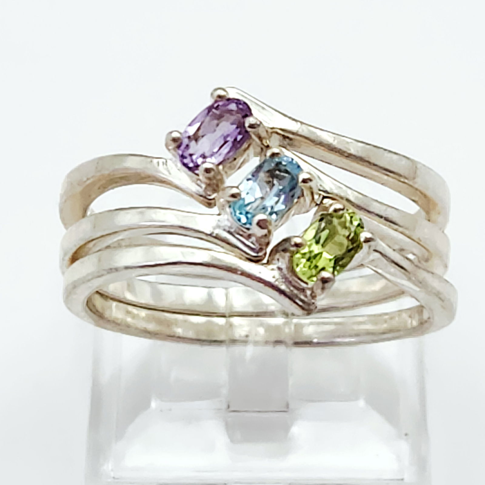 Trio of Sterling & Gemstone Rings 6.3 Grams: Three sterling silver rings set with purple, blue, and green gemstones, weighing a total of 6.3g and measuring approximately US size 10. Good vintage condition.