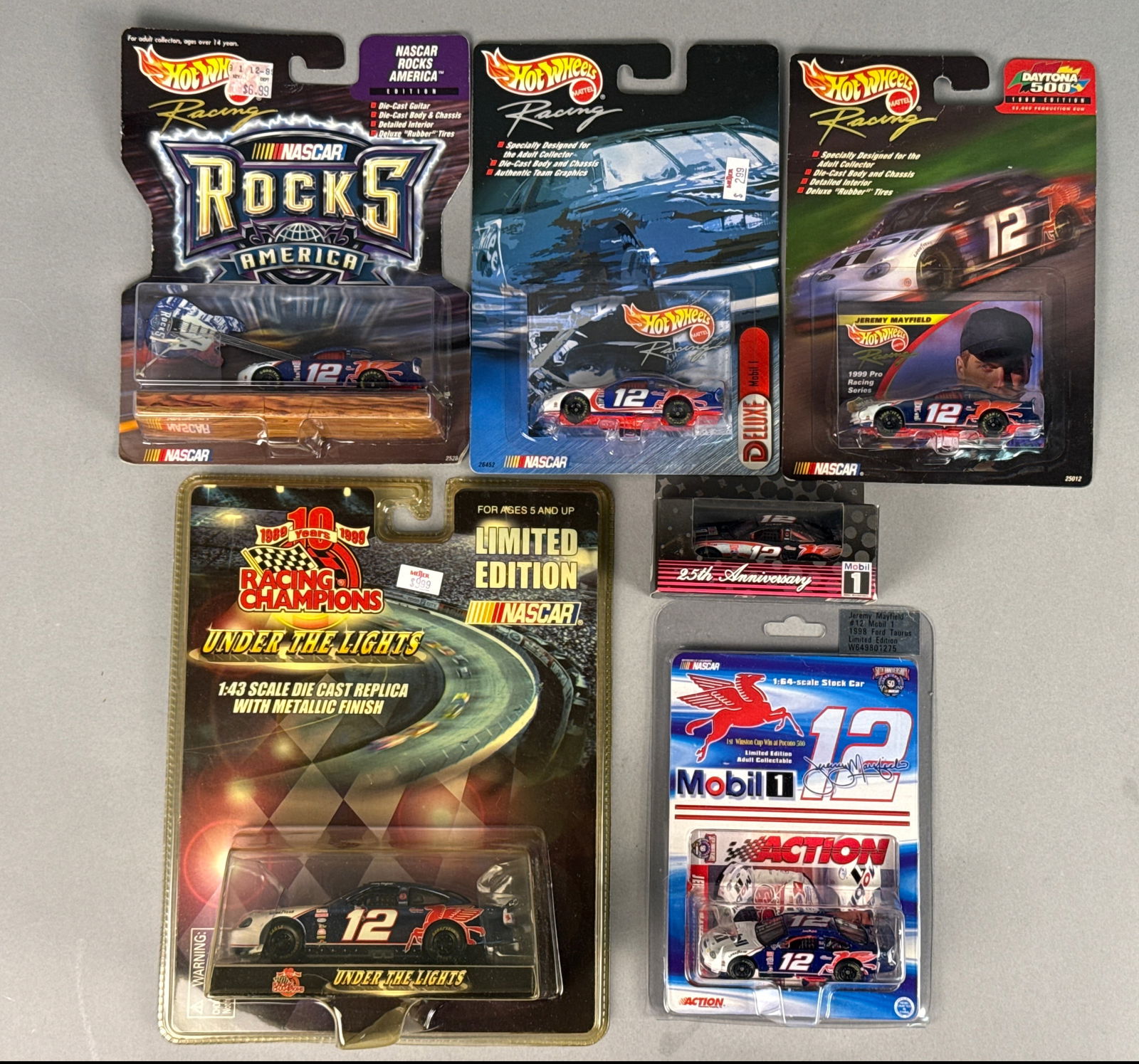 Hot Wheels, Racing Champions, and Action NASCAR Jeremy Mayfield #12 Die-Cast Model Collection, circa: A collection of six (6) die-cast stock car models manufactured by Hot Wheels (Mattel), Racing Champions, and Action Performance Companies, Inc. This assembly focuses on Jeremy Mayfieldâ€™s #12