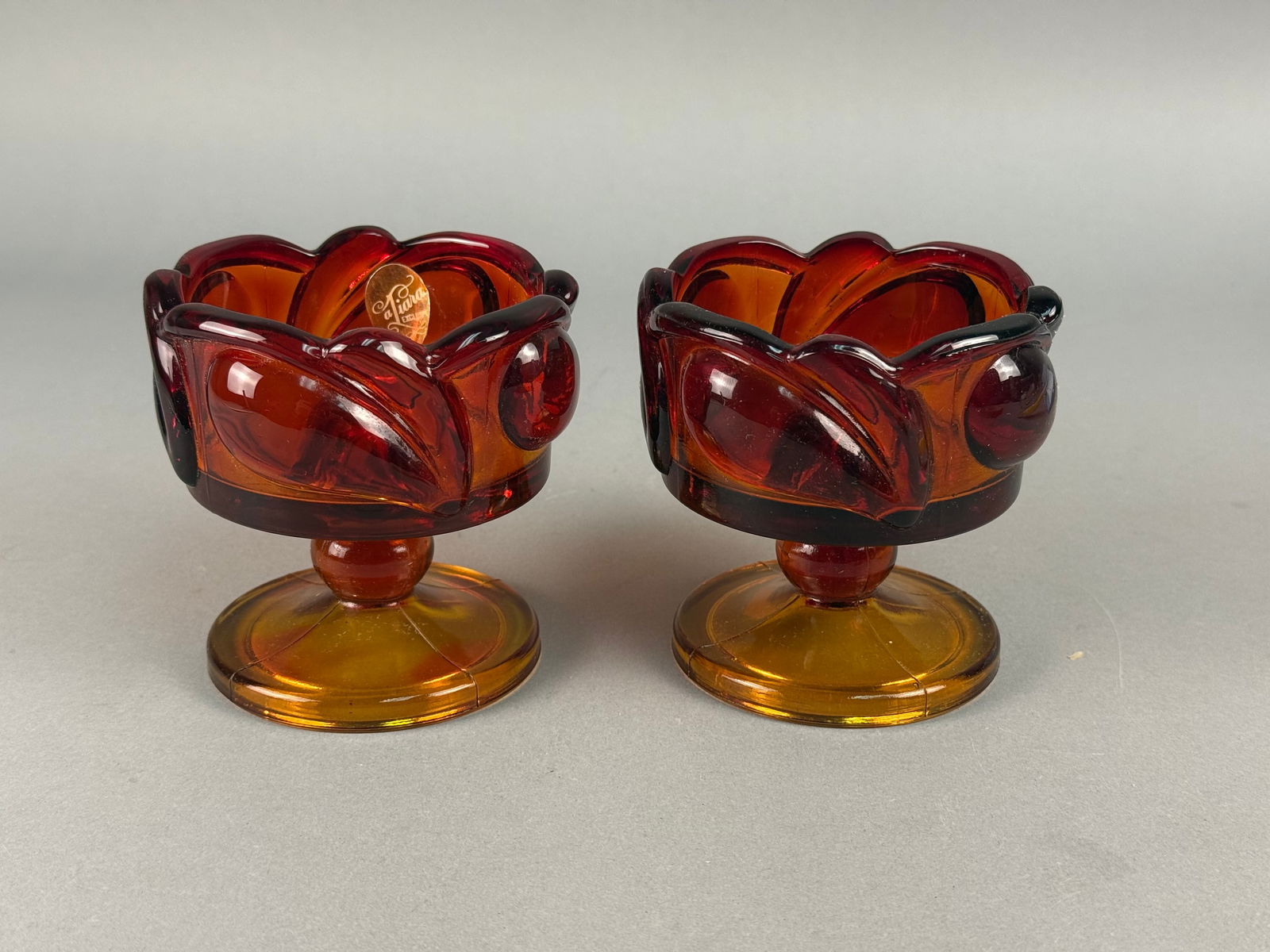 A Pair of Tiara Exclusives Stylized Leaf Amberina Glass Votive Candle Holders (1 of 5)
