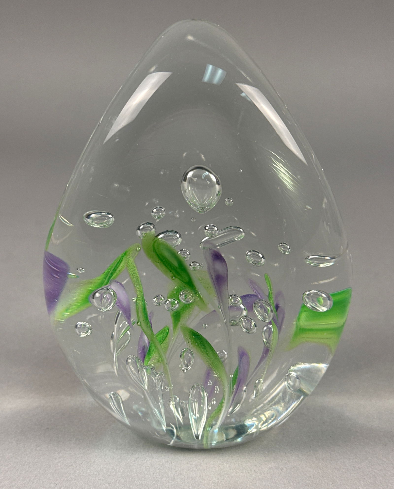 Josh Simpson Hand-Blown Art Glass Sculptural Paperweight: A fine contemporary American art glass sculptural paperweight by renowned artist Josh Simpson. This 1986 piece features an ovoid, teardrop form of heavy clear glass encasing an intricate internal land