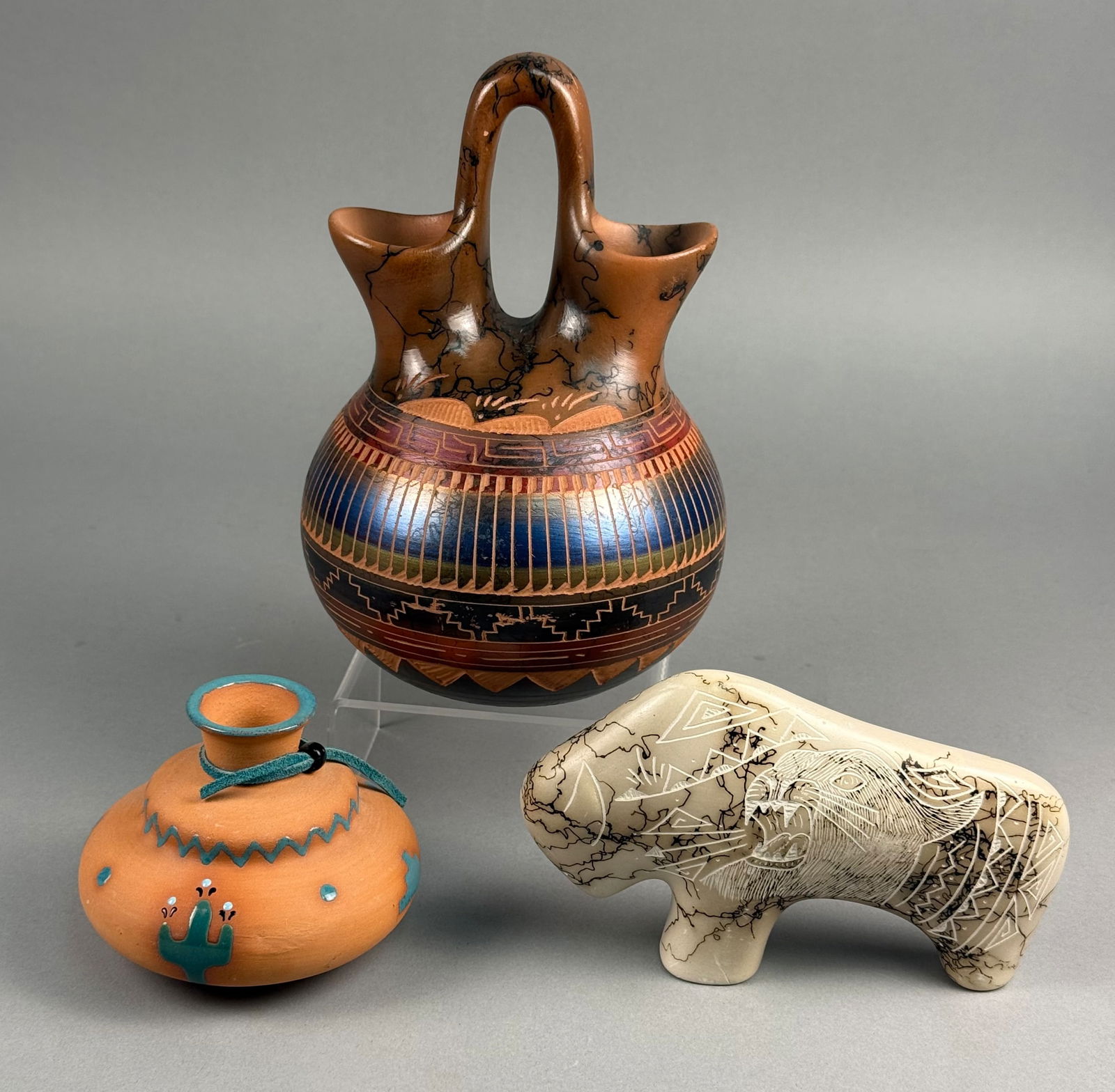 A Trio of Navajo Horsehair and Southwestern Style Pottery Objects: A trio of contemporary Navajo horsehair and Southwestern-style ceramic decorative objects. The group includes a wedding vase featuring horsehair pottery techniques with dark carbonized lines on the up