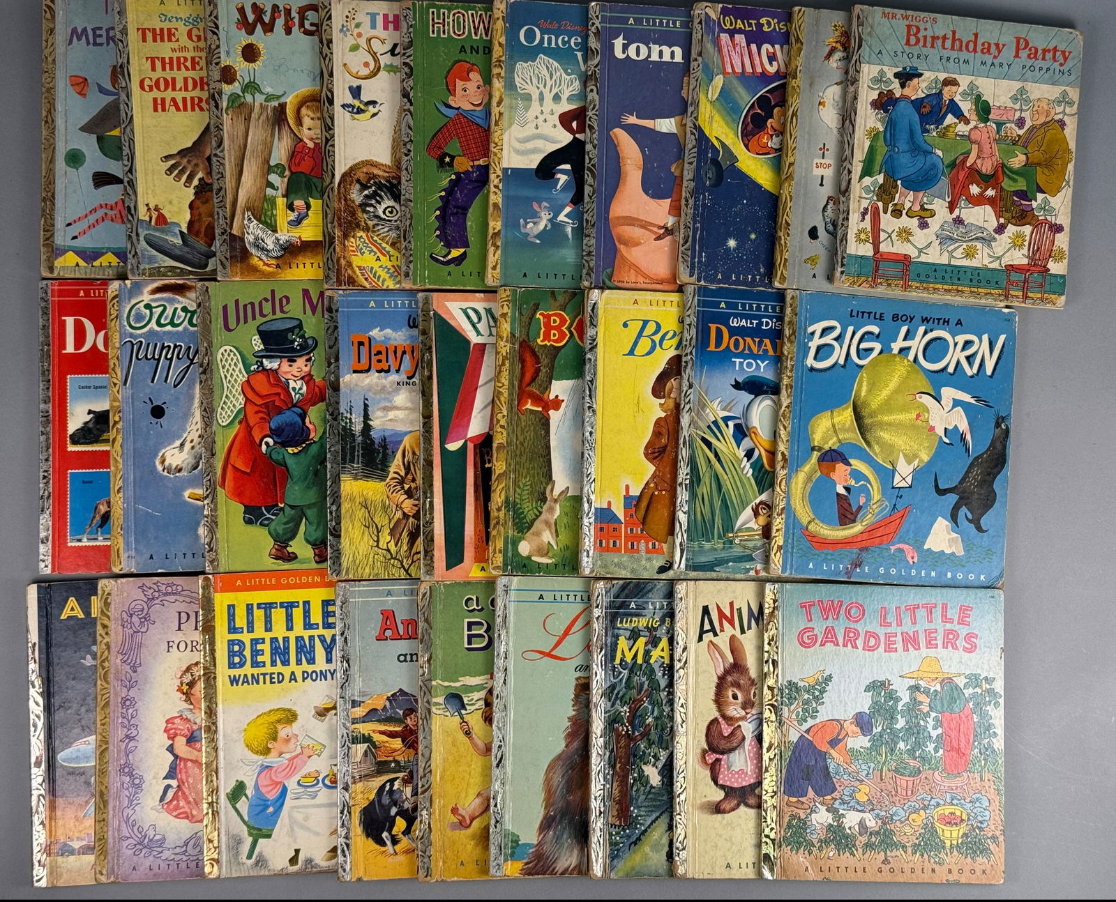 A Collection of Vintage Little Golden Books: A collection of vintage Little Golden Books published by Simon and Schuster and Golden Press, New York. This group of mid-20th-century hardcover children's books features various titles including Walt