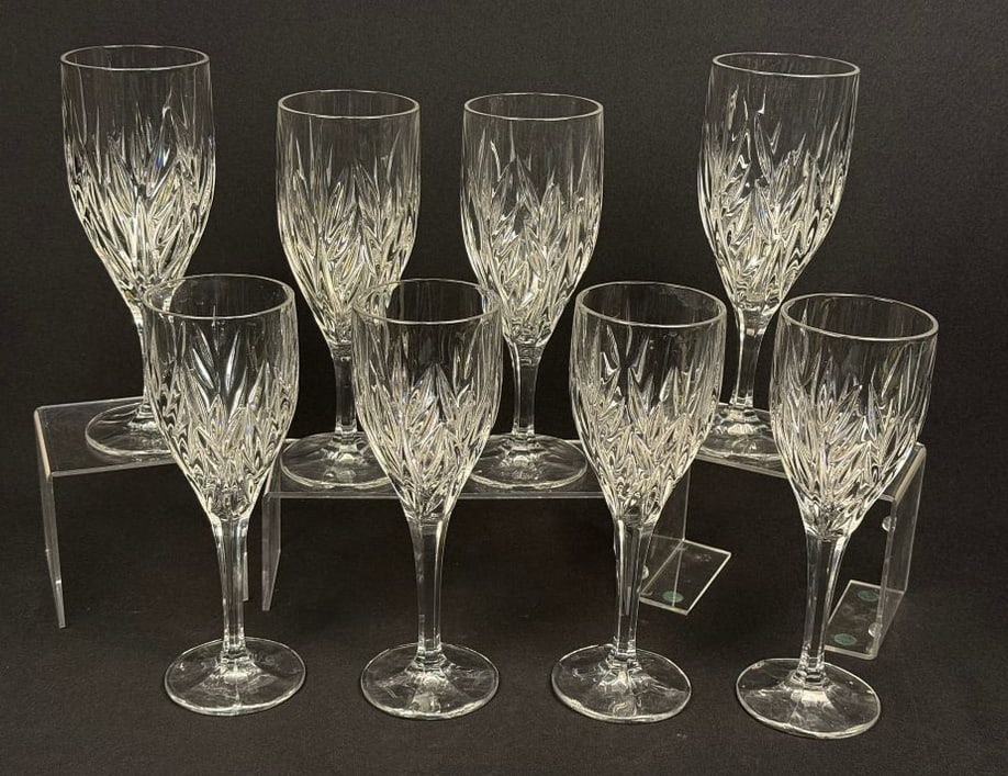 A Collection of Gorham Star Blossom Crystal Stemware: A collection of crystal stemware in the Star Blossom pattern by Gorham. The group includes two sizes of glasses suitable for wine and aperitifs. Each piece is constructed from clear cut crystal featur