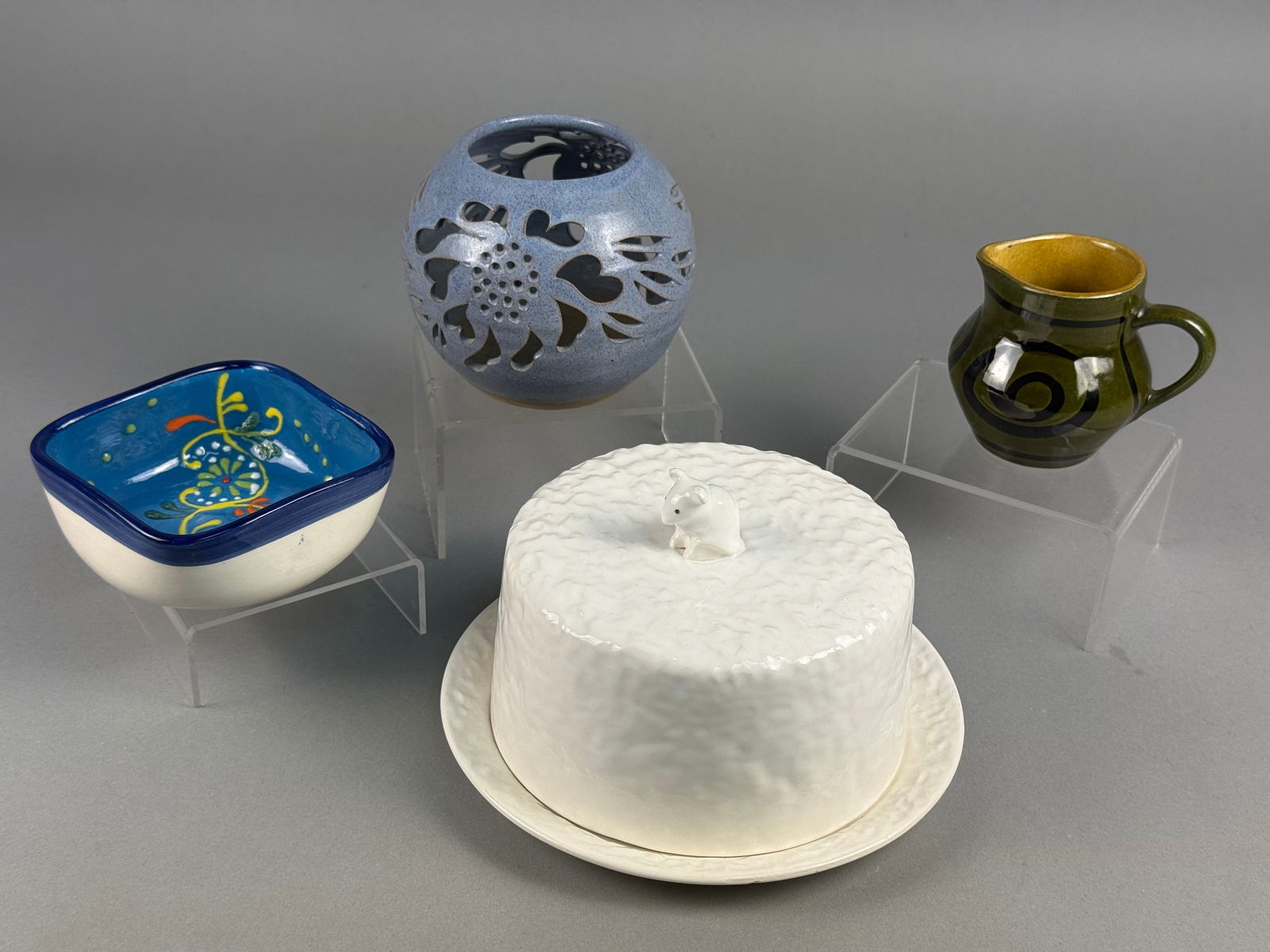 A Collection of European Ceramics including a Sylvac Cheese Dish and Susan Bennett Stoneware: A collection of decorative and functional ceramic items representing various European pottery traditions. The group features a Sylvac white textured ceramic covered cheese dish with a mouse-shaped fin
