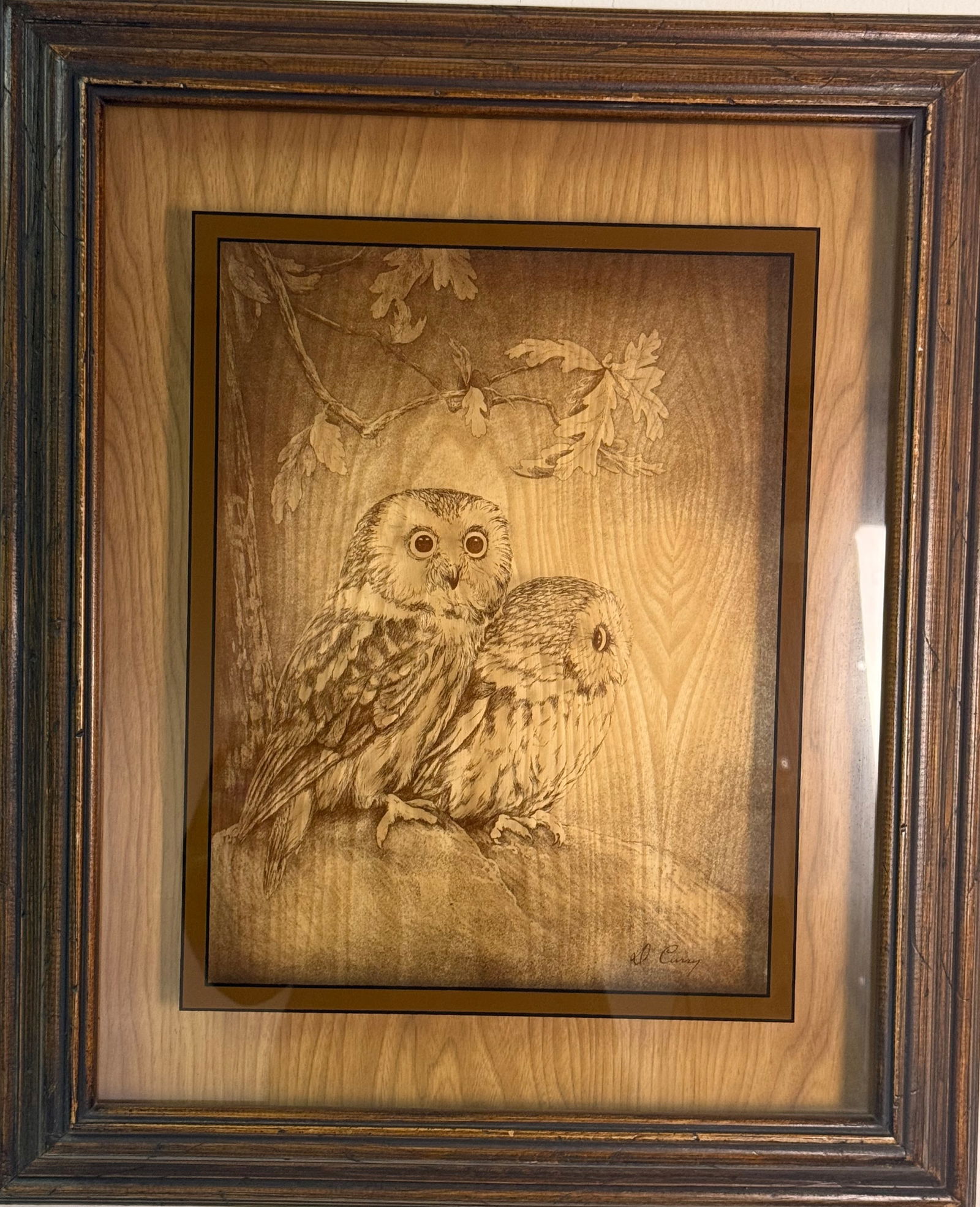 Dennis Curry (American, b. 1945) 'Owls' (Signed): Dennis Curry (American, b. 1945). This work depicts two owls perched on a branch amidst oak leaves, rendered in a monochromatic sepia tone. The piece is a production by Lucid Lines, circa 1976,