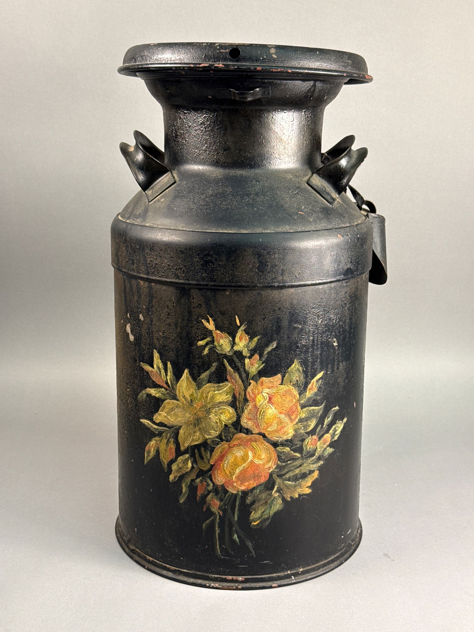Vintage Hand-Painted Toleware Metal Milk Can with Matching Scoop, circa 1950: This vintage metal dairy can is a classic example of mid-century folk art, featuring a heavy-gauge steel construction finished in matte black paint. The front of the vessel is decorated with a hand-pa