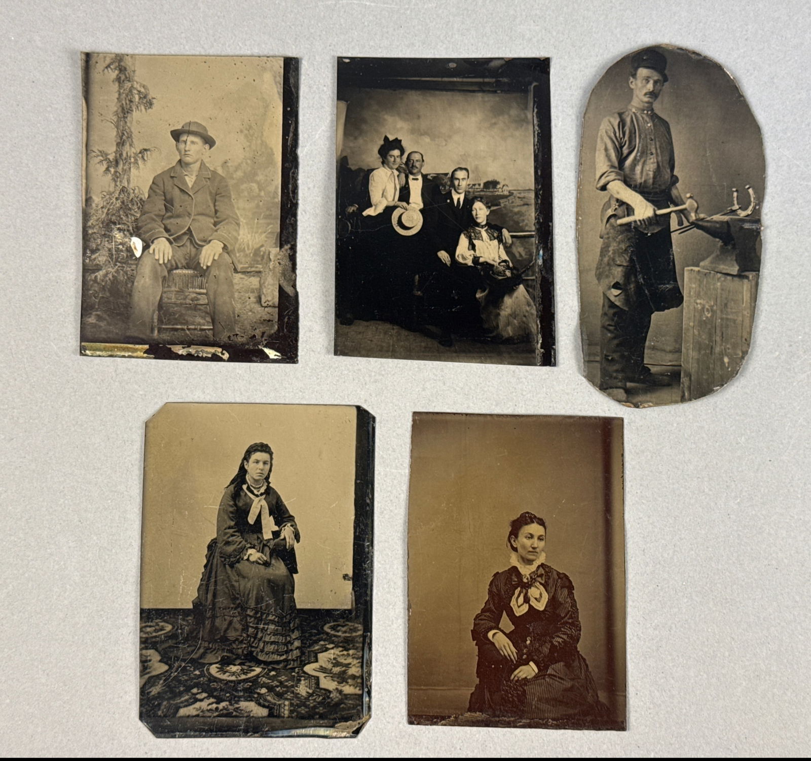 Unknown Photographer, 'Collection of Five Tintypes Including a Blacksmith Occupational Portrait',: This collection features five vintage 19th-century tintypes, a direct-positive photographic process on japanned iron plates. The highlight of the lot is a rare occupational portrait of a blacksmith or