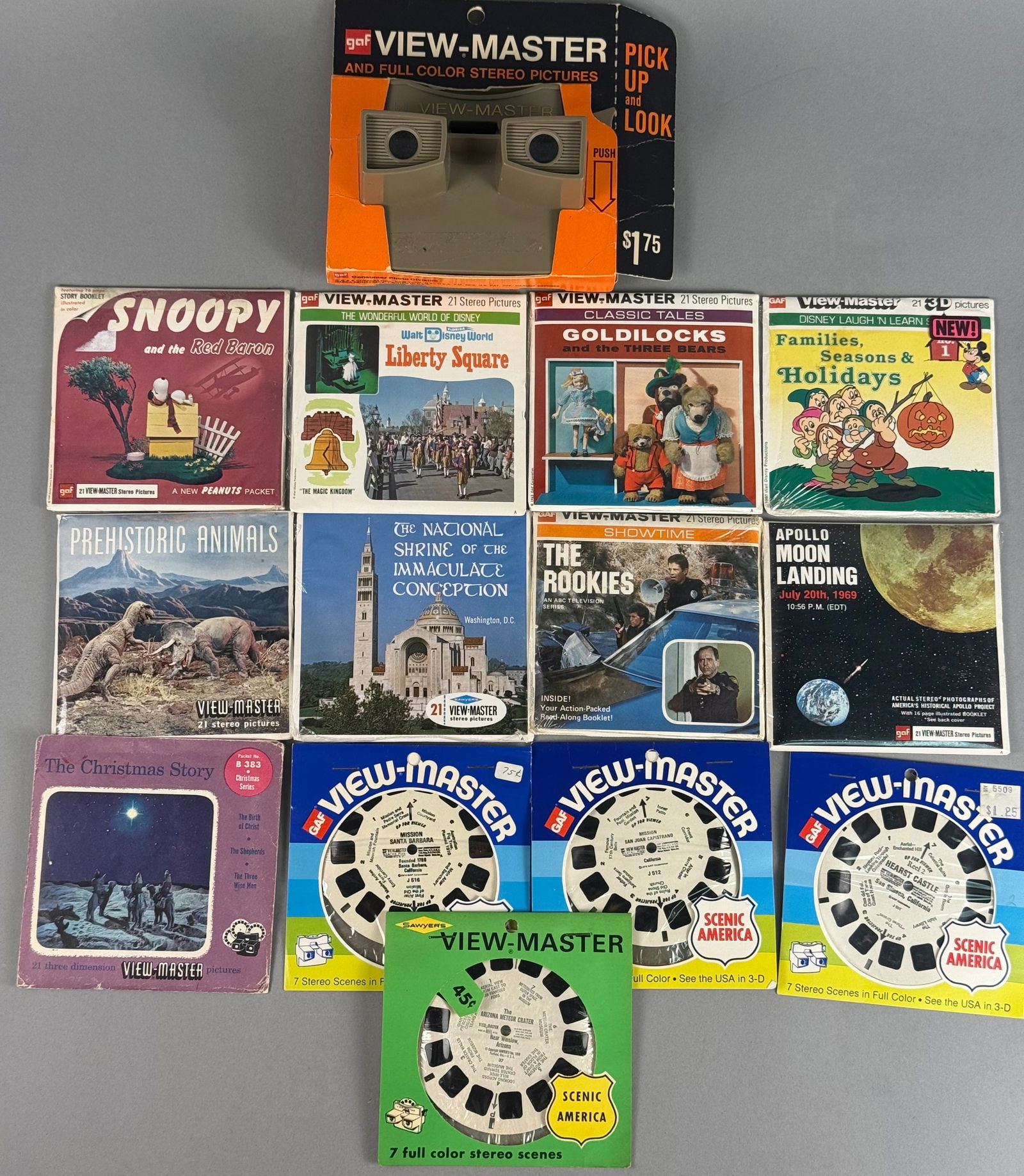 GAF View-Master Stereo Viewer and Extensive 3D Reel Unopened Collection, c. 1948-1980: This comprehensive collection features a vintage GAF View-Master stereo viewer and a diverse assortment of 3D stereo picture reels produced by GAF Corporation and Sawyer's Inc. The tan plastic viewer