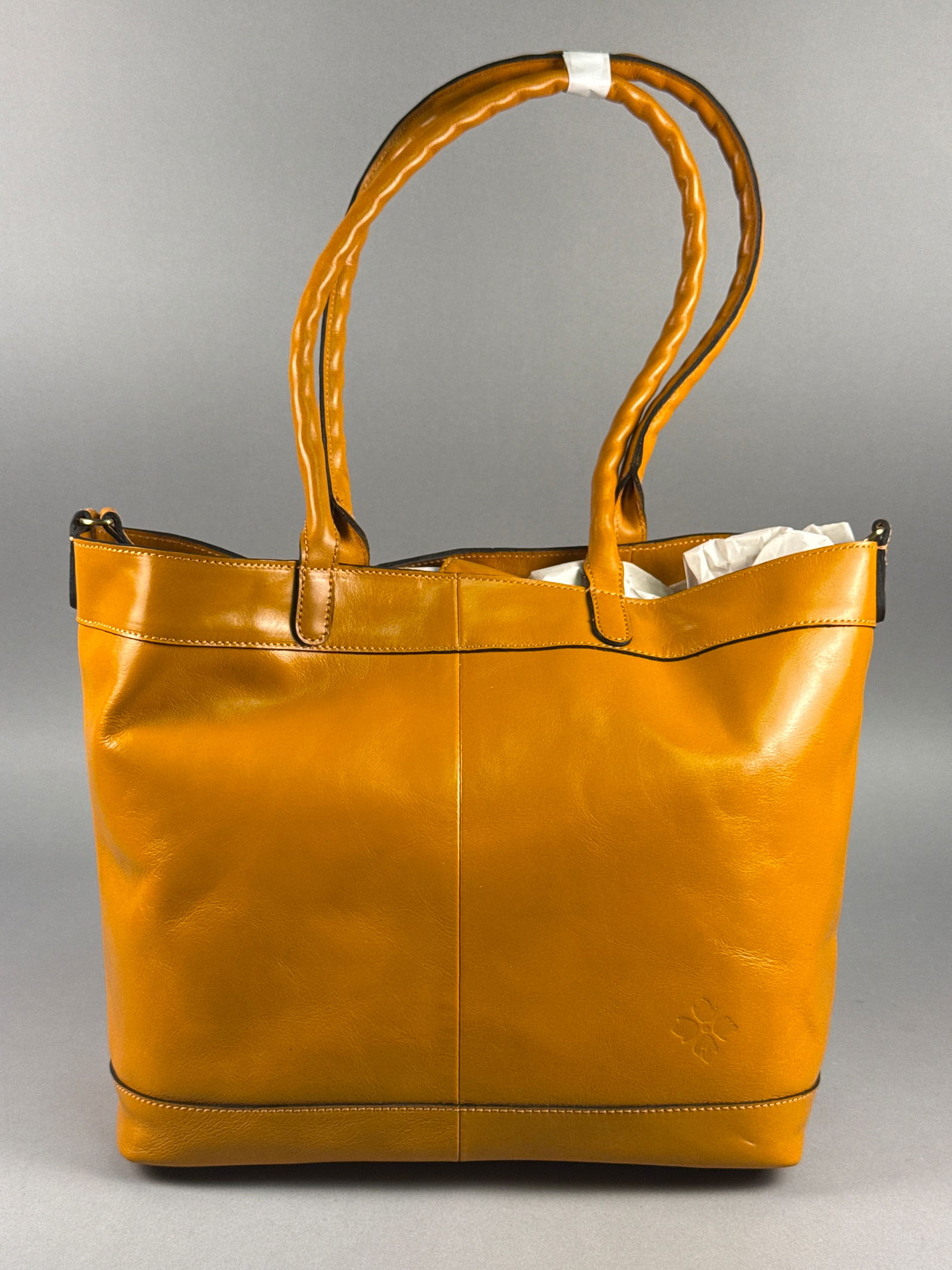 Patricia Nash Mallory Distressed Leather Tote, Sun Yellow: This Patricia Nash Mallory tote is crafted from full-grain leather in Sun Yellow from the brand's Distressed Vintage Leather Collection. The exterior features the signature embossed grape leaf logo on