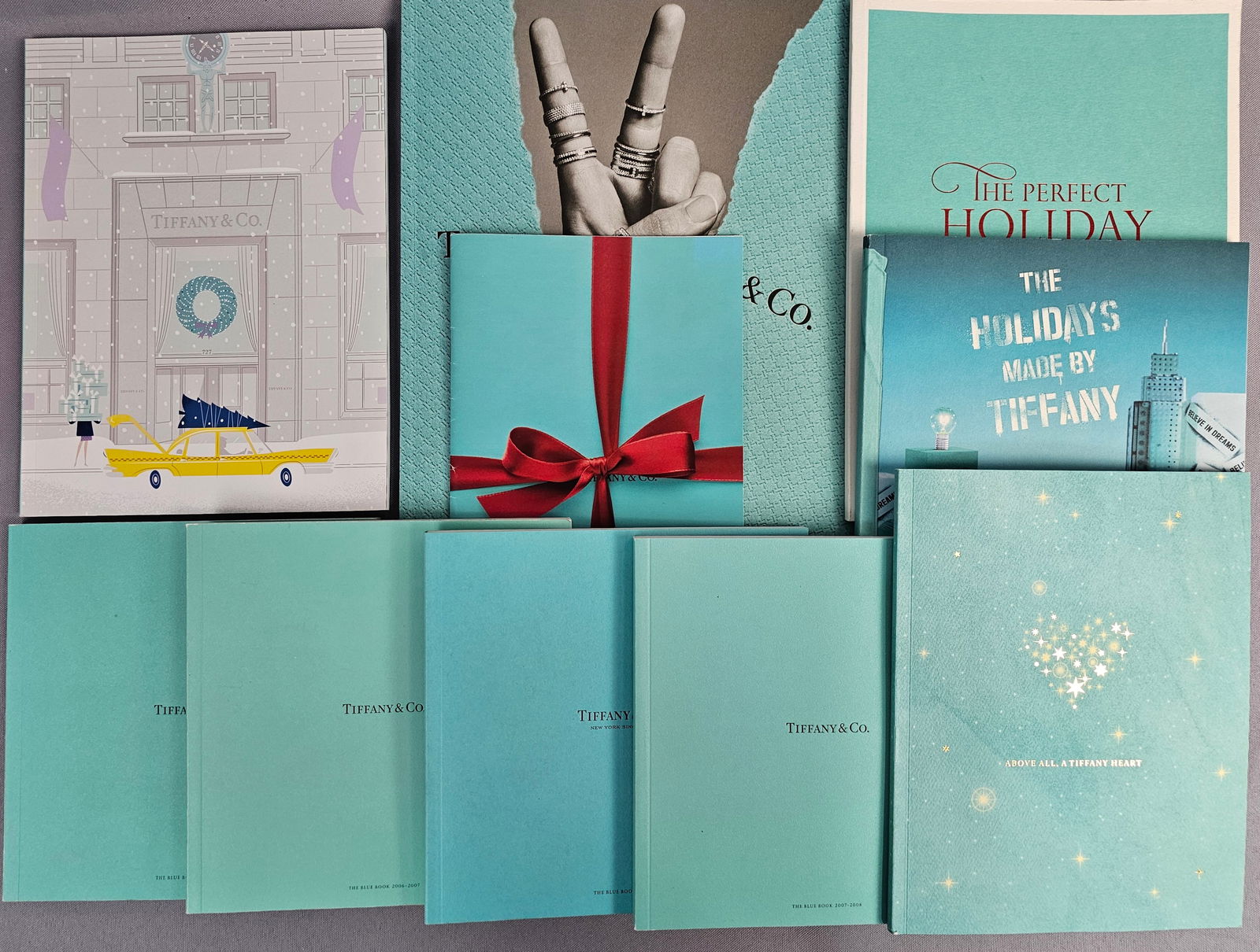 Tiffany & Co., Collection of Ten Blue Books and Holiday Jewelry Catalogs, Various Editions,: Tiffany & Co., Collection of Ten (10) High Jewelry and Holiday Catalogs, Tiffany & Co., 2006-2013, Various Editions. This comprehensive collection includes four editions of the prestigious Blu