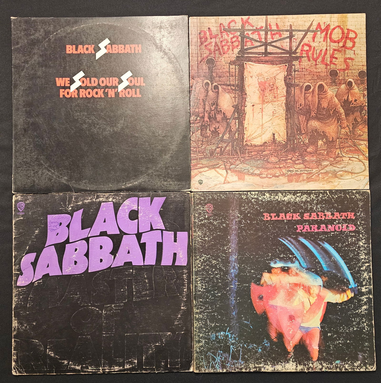 A Collection of Black Sabbath Vinyl LP Records: A collection of vintage Black Sabbath long-play vinyl records released under the Warner Bros. Records label between approximately 1970 and 1981. The group includes the studio albums Paranoid (WS