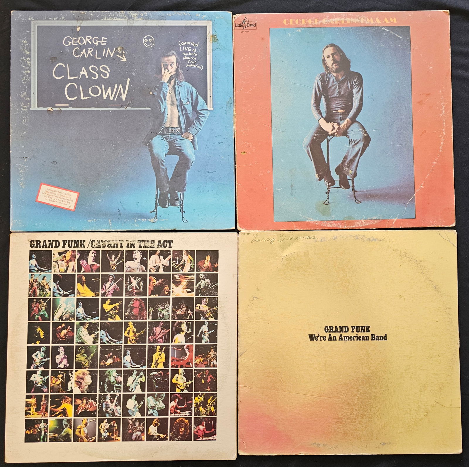 George Carlin and Grand Funk Railroad, Collection of Four Vintage Vinyl LP Records, 1972-1975: This collection comprises four vintage 12-inch vinyl LP records featuring comedy and rock performances. Cardboard sleeves are in worn vintage condition. Some tears to corners. Vinyl records are in va