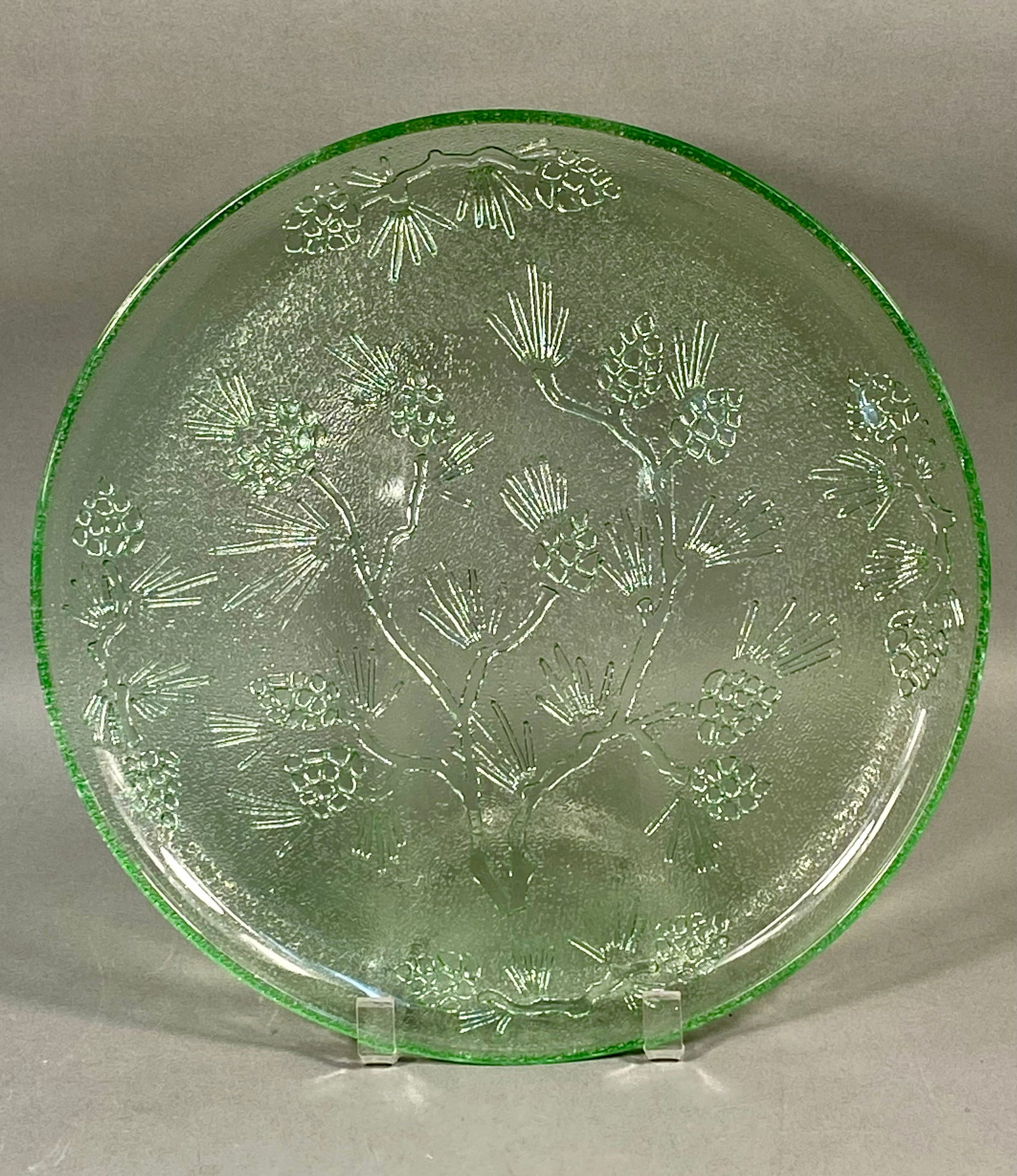 Tiara Exclusives, Pressed Glass, Ponderosa Pine Serving Tray: This large circular serving platter was produced by the Indiana Glass Company for Tiara Exclusives as part of the Ponderosa Pine collection. The tray is crafted from translucent light green pressed gl