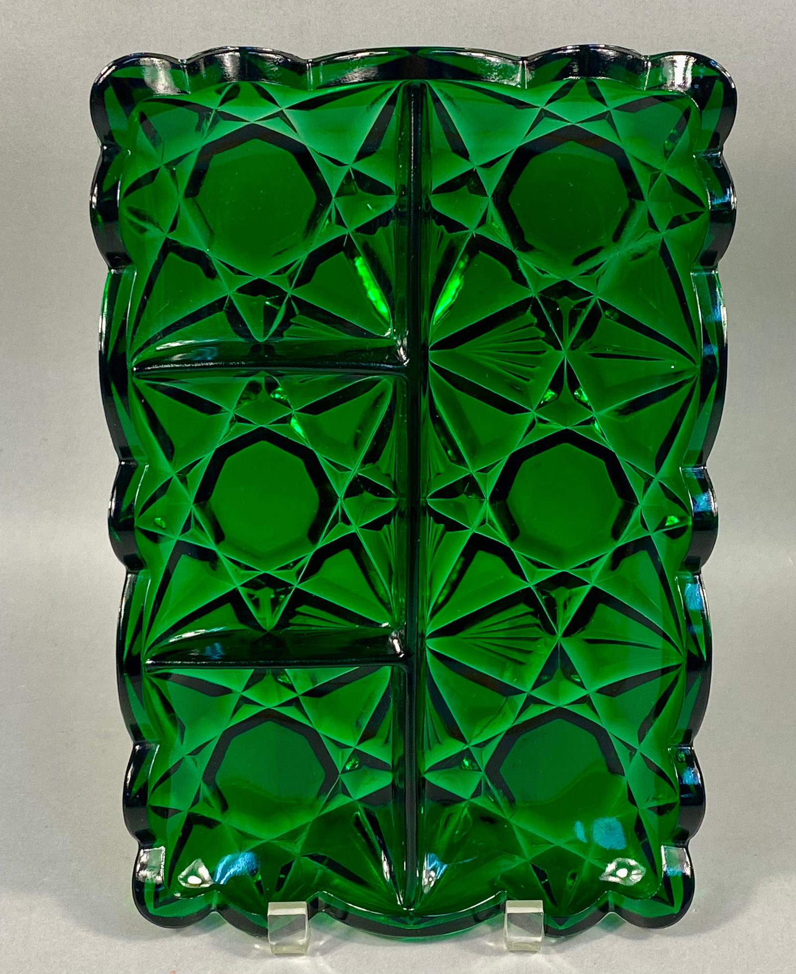 American Pressed Glass Emerald Green Divided Relish Tray: A mid-20th-century American pressed glass divided relish tray executed in a deep emerald green color. The rectangular serving piece features five internal compartments separated by integrated glass di