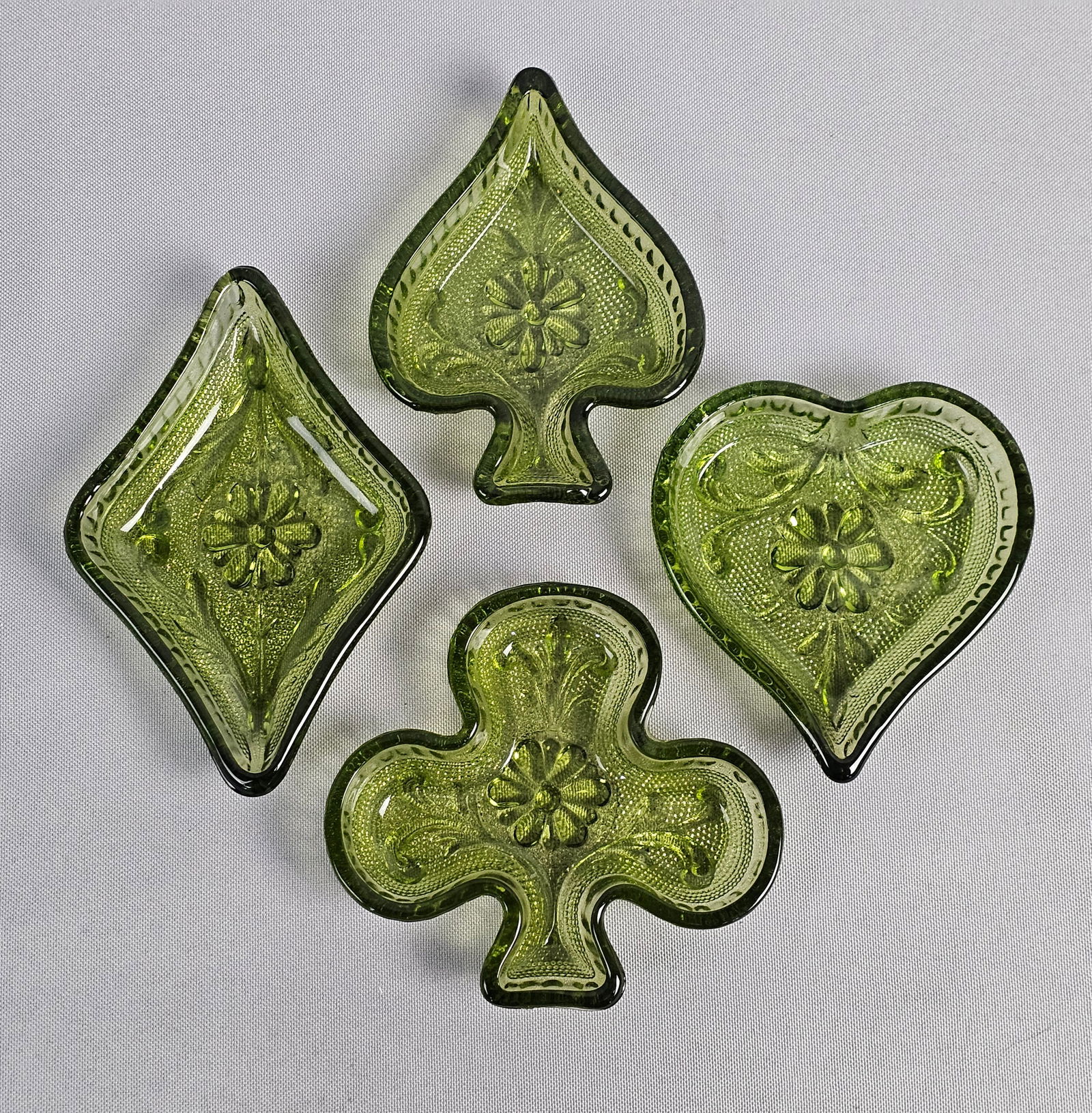 Indiana Glass Pressed Sandwich Pattern Glass Card Suit Bridge Set: This set of vintage pressed glass dishes, known as a Bridge Set, represents the four suits of playing cards: Heart, Spade, Club, and Diamond. Attributed to Indiana Glass for Tiara Exclusives as part o