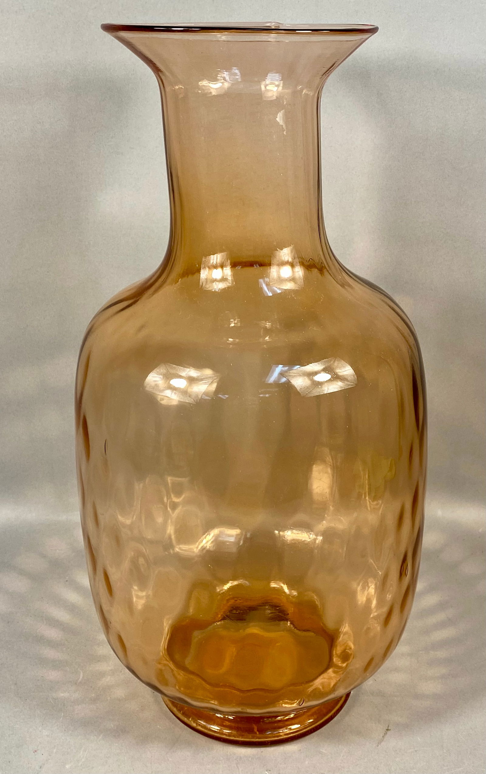 Tiara Exclusives Pink Optic Glass Demijohn Vase in Original Box: A mold-blown glass demijohn vase produced for Tiara Exclusives. The vessel features a bulbous body with a repetitive optic honeycomb or thumbprint texture, tapering to a long neck with a flared, polis