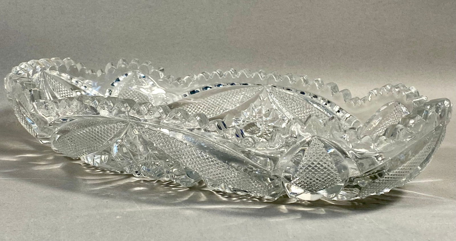 Imperial Glass Company Nucut Pressed Glass Celery Tray: An oval pressed glass serving dish, identified as a celery tray, manufactured by the Imperial Glass Company of Bellaire, Ohio. This piece is part of the Nucut line, produced in the early 20th century
