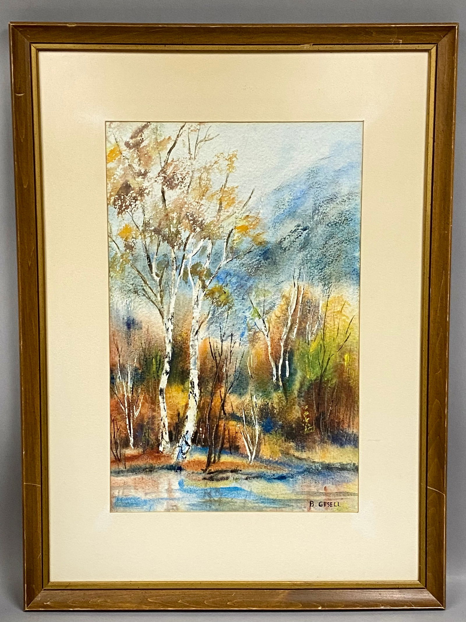 B. Gesell, Impressionistic Autumn Landscape with Birch Trees: This original landscape is rendered in watercolor and gouache on textured cold-pressed paper. The composition depicts a cluster of birch trees at the edge of a body of water during the autumn season,