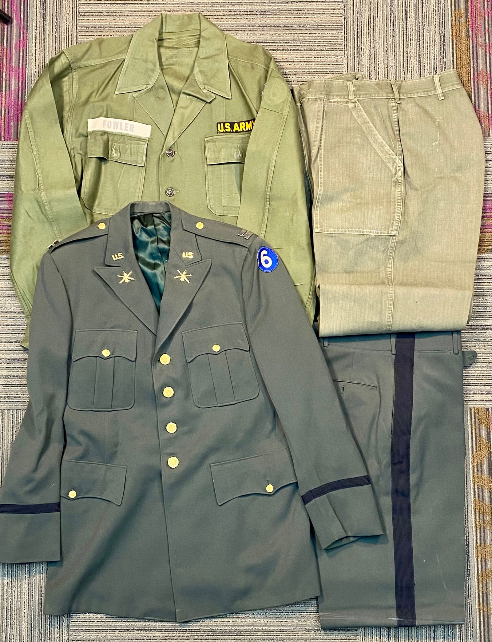 Two US Army Uniform Sets Including 1959 Officer Green Service Dress and OG-107 Fatigue Set: This lot consists of two US Army uniform sets from the Cold War era, both featuring the insignia of the 6th Infantry Division. The first set is a US Army Green Service Uniform (Class A) produced by th