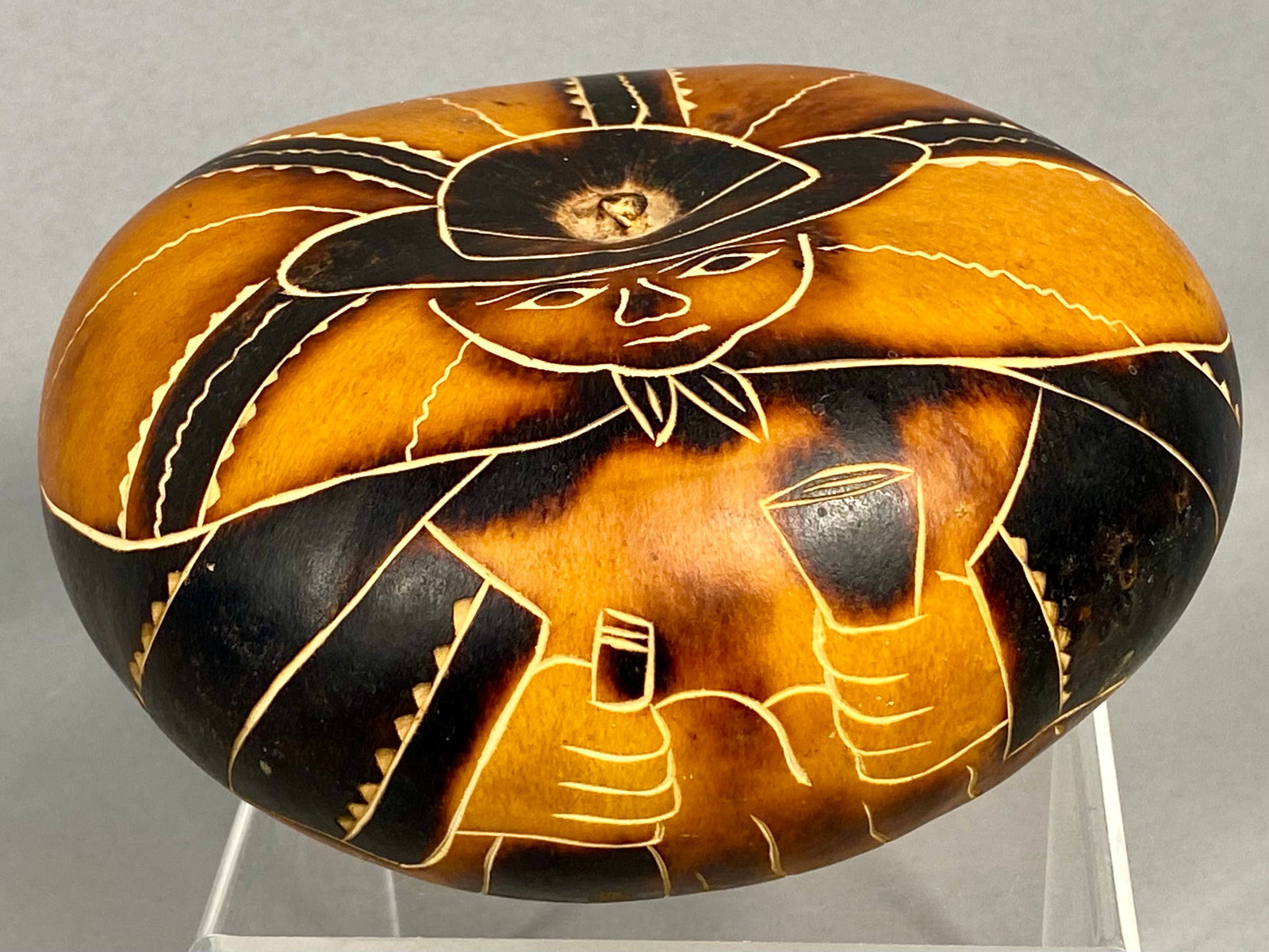 Peruvian Hand Carved and Burnt Mate Burilado Gourd: A contemporary Peruvian folk art gourd, traditionally known as a Mate Burilado, crafted from a dried Lagenaria siceraria gourd. The surface is decorated using fine-line carving and pyrography techniqu