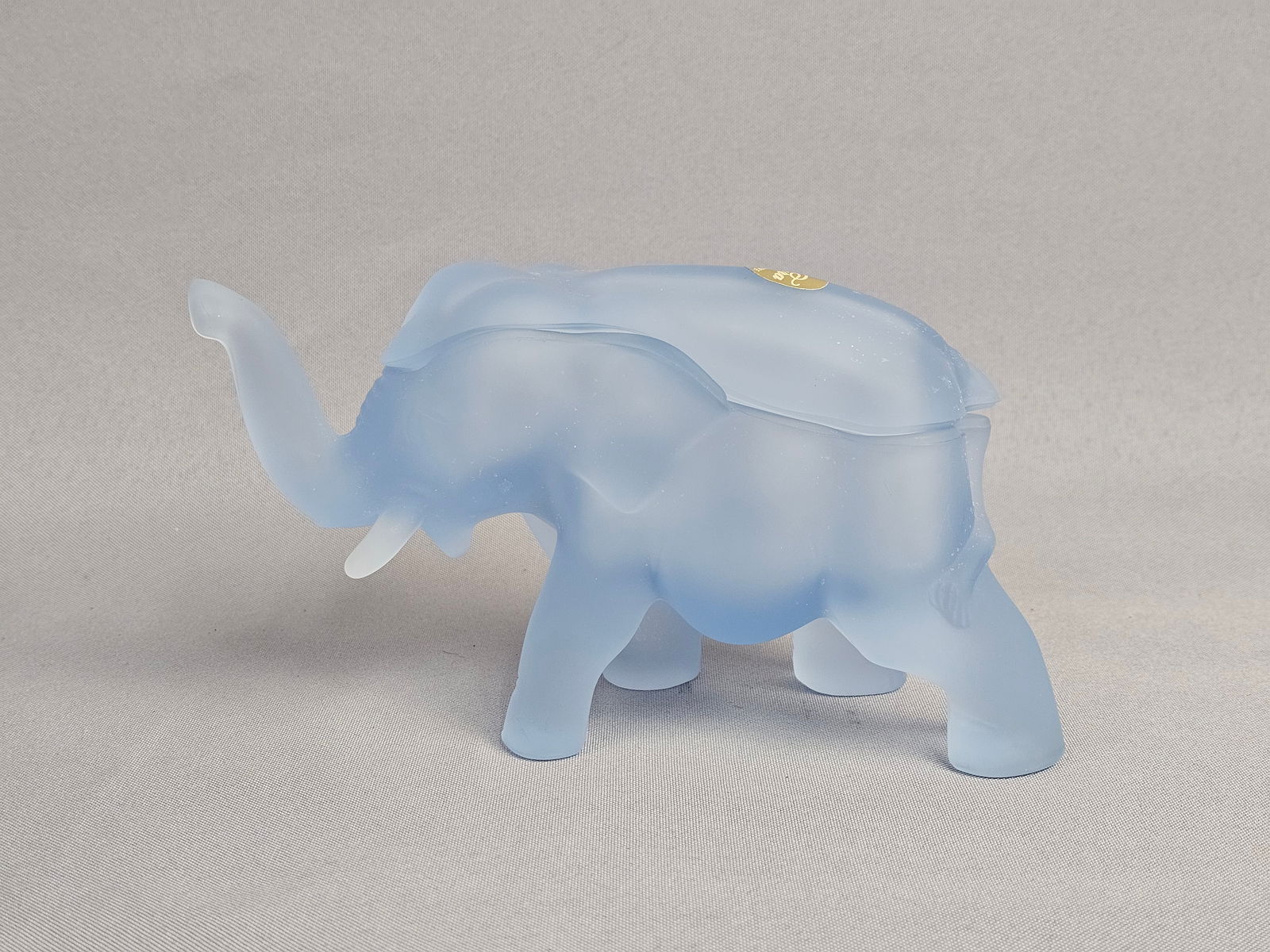 Tiara Exclusives Frosted Blue Satin Glass Elephant Lidded Candy Dish: Tiara Exclusives elephant-shaped lidded trinket box or candy dish. The piece is constructed from frosted light blue satin glass and features a two-part design where the upper portion of the elephant's