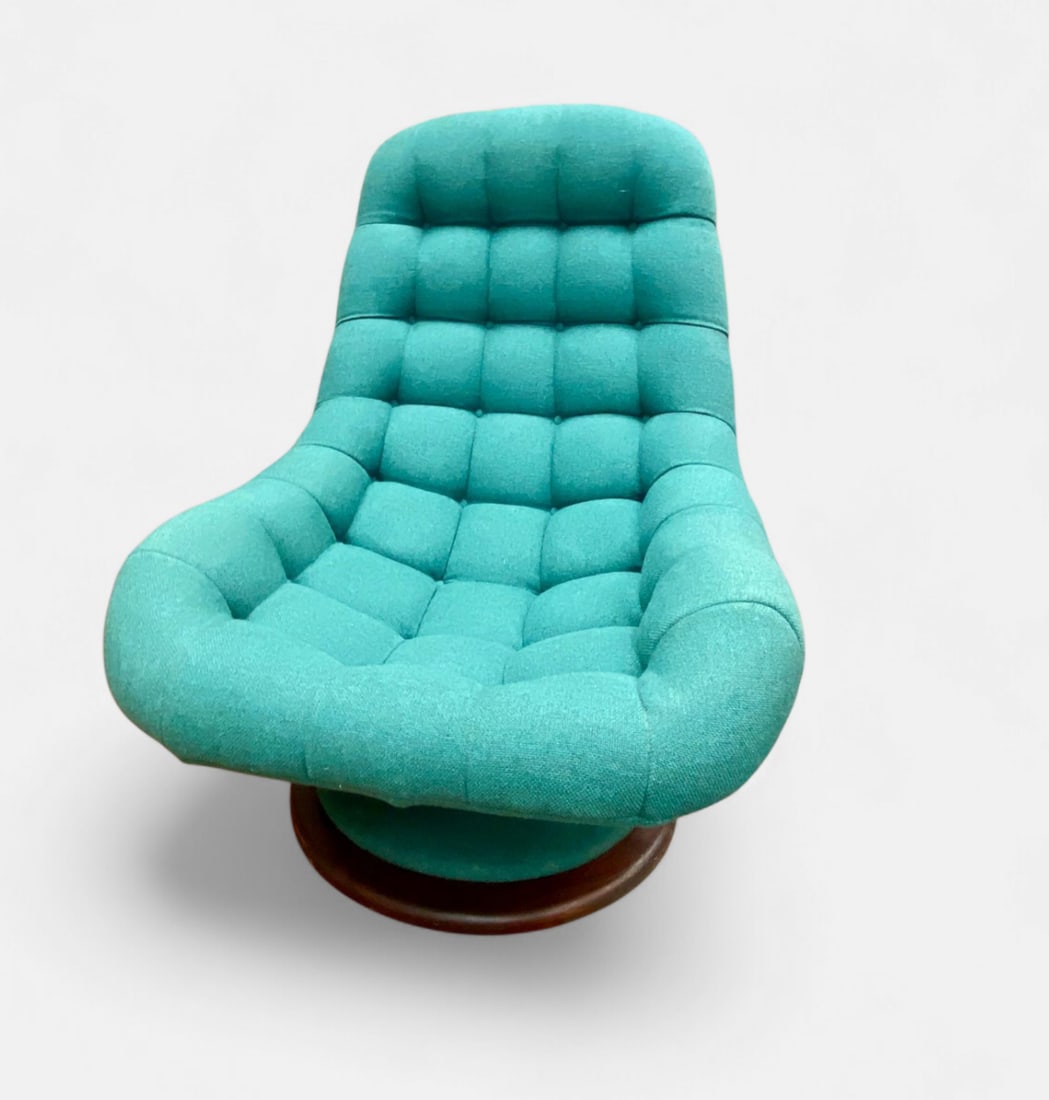 R. Huber and Co. Mid-Century Modern Teak Scoop Swivel Lounge Chair: This mid-century modern scoop style swivel lounge chair was produced by R. Huber and Co. (Canada) Ltd. in Downsview, Ontario. The piece features a continuous back and seat design with deep button tuft