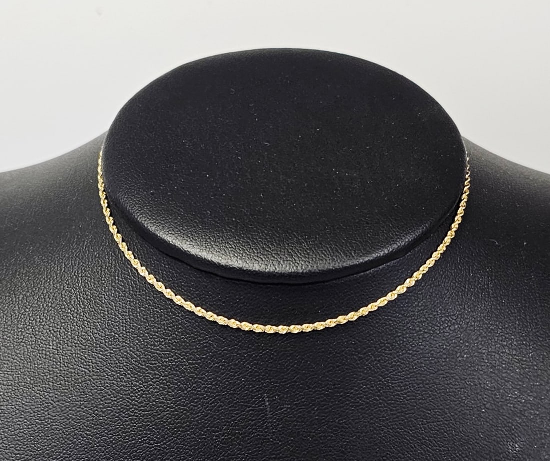 14K Gold Rope Chain Anklet or Bracelet 2.4 Grams: A 14-karat yellow gold rope chain featuring a classic twisted link construction. The piece is finished with a secure lobster claw clasp and teardrop-shaped end connectors. The flat end connector is