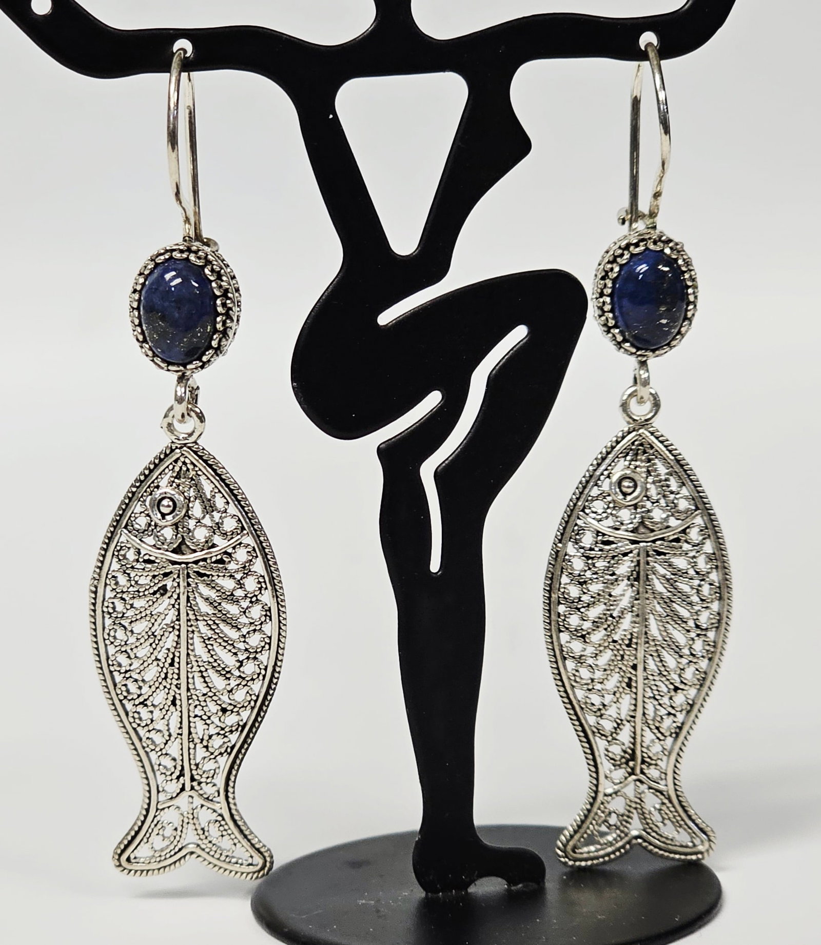 DGS Turkey Sterling & Lapis Fish Earrings 8.3 Grams: A pair of articulated dangle earrings in sterling silver. The earrings are equipped with French hook ear wires. The reverse of each fish dangle is stamped with an oval mark reading DGS TURKEY 925. 