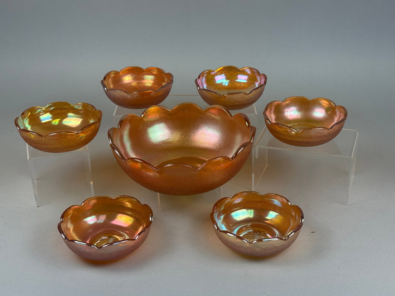 A Seven-Piece Set of Marigold Carnival Glass Tree Bark Pattern Berry Bowls (1 of 17)