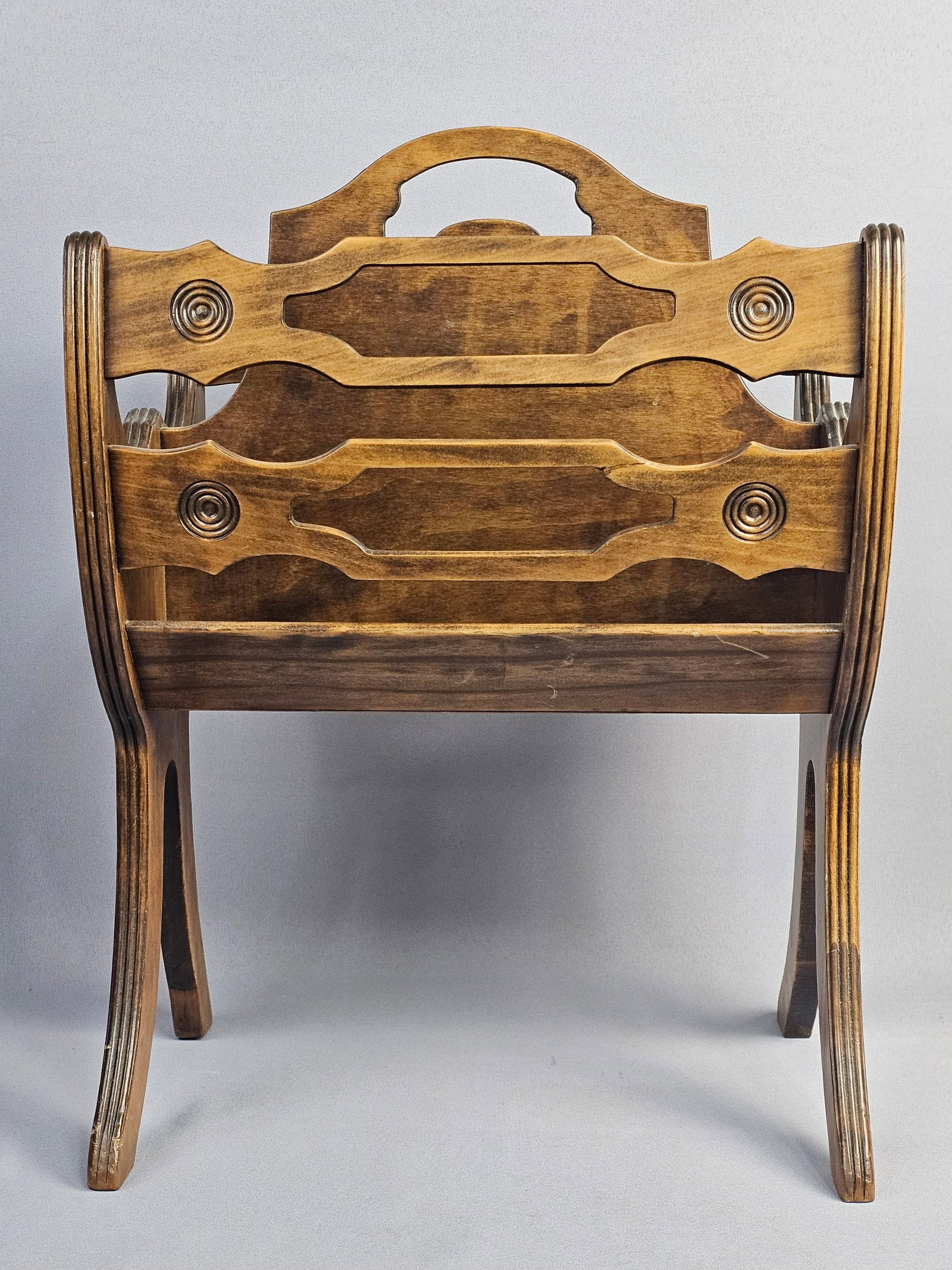 Mid-Century Butler Style Wooden Magazine Rack: No maker marks are visible on the exterior or underside. Measures 21 inches H x 16 inches W x 10.5 inches D. The item shows signs of age and use consistent with a mid-century piece.
