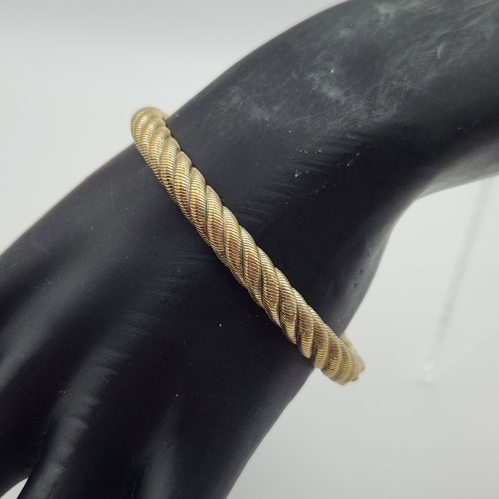 Judith Ripka Vermeil Bracelet 26.6 Grams: A gold over sterling silver, vermeil, twisted rope-style cuff bracelet featuring turquoise-colored cabochon end caps, weighing 26.6 grams and measuring approximately 2.5 inches in diameter. Overall v