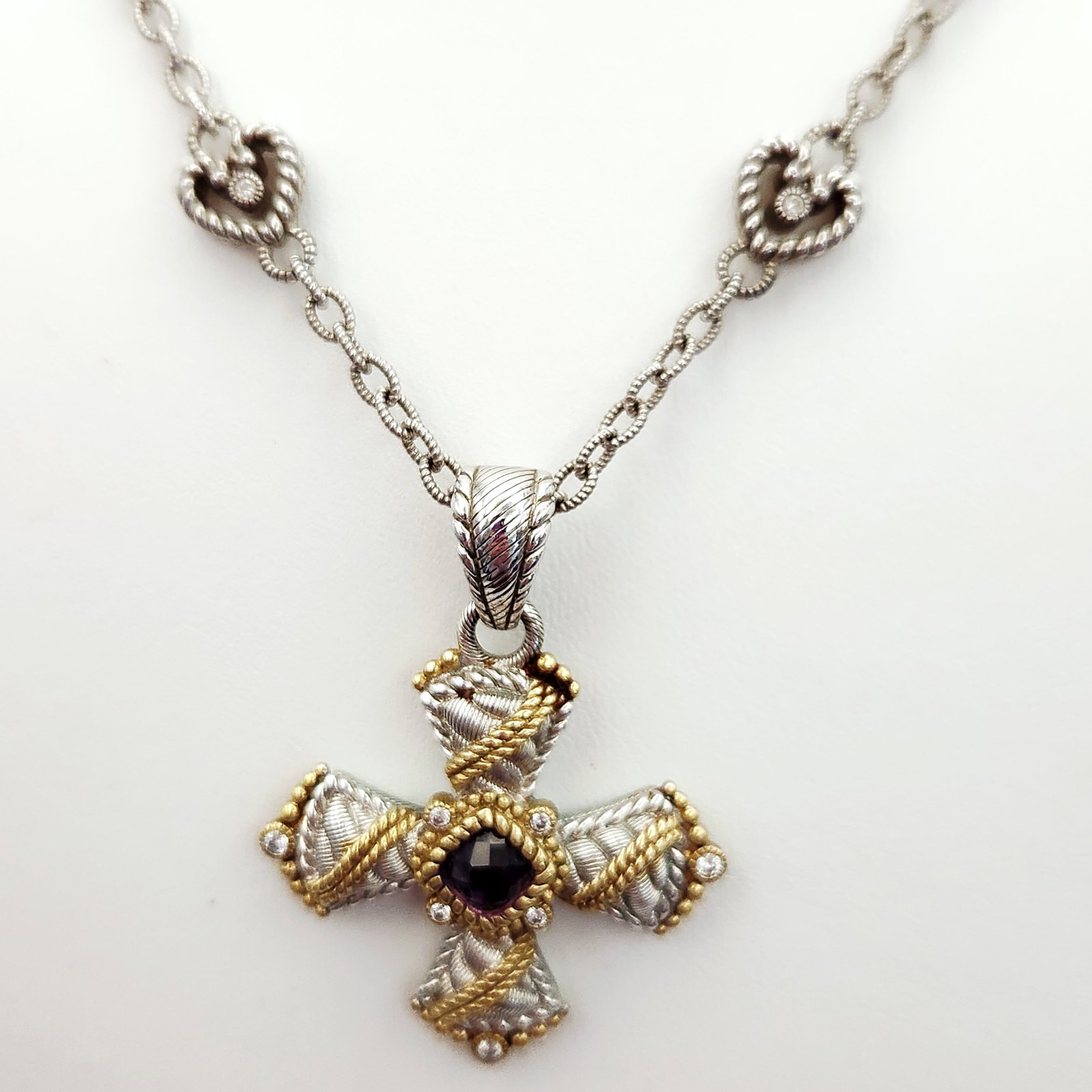 Judith Ripka Sterling & Vermeil Cross Necklace 34.5 Grams: A designer necklace by Judith Ripka featuring a decorative cross pendant and a coordinating chain. The pendant is crafted from sterling silver with gold-tone accents and features a textured cable-styl