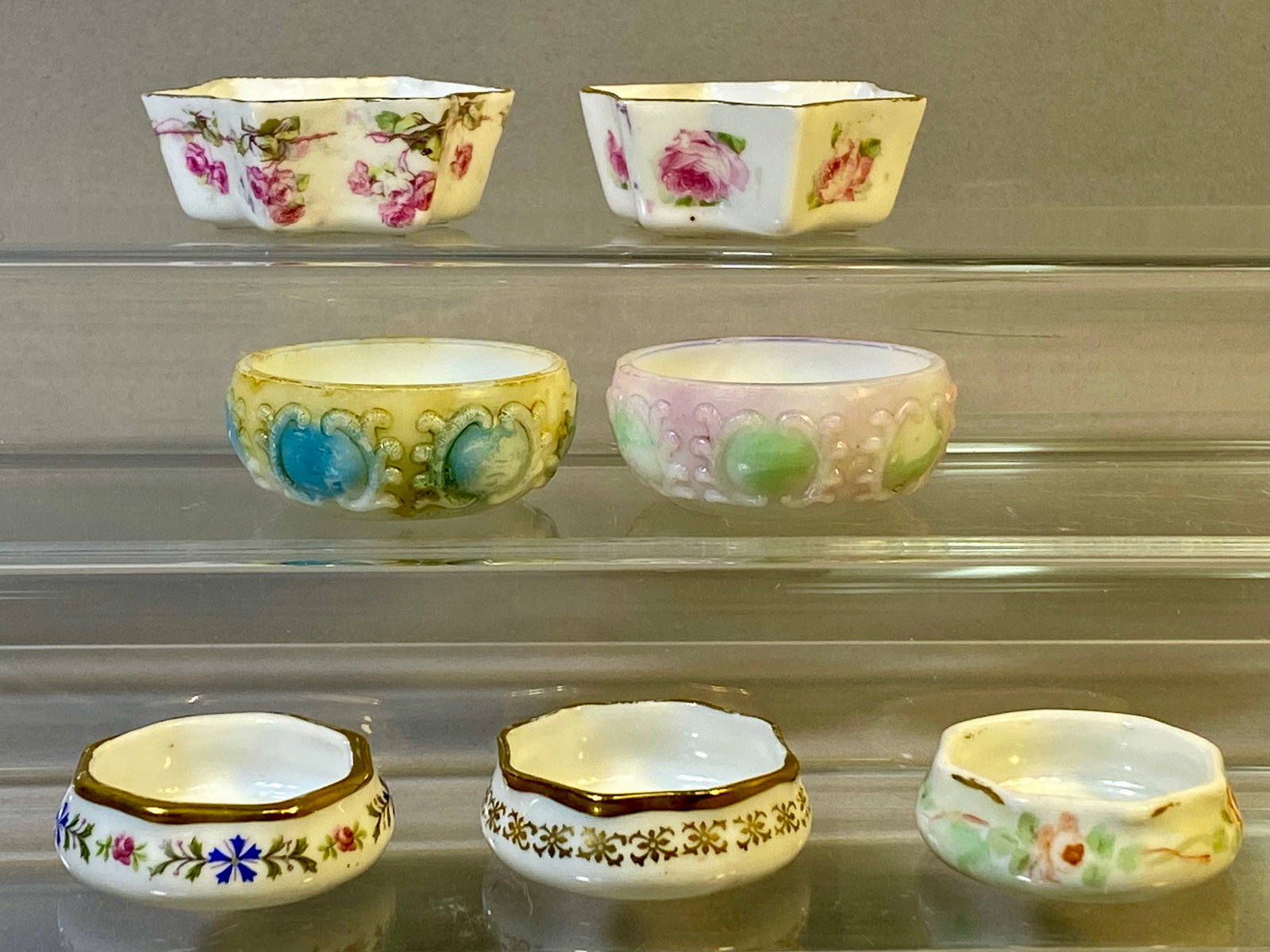 An Assortment of Seven Porcelain and Opaque Glass Salt Cellars (1 of 9)