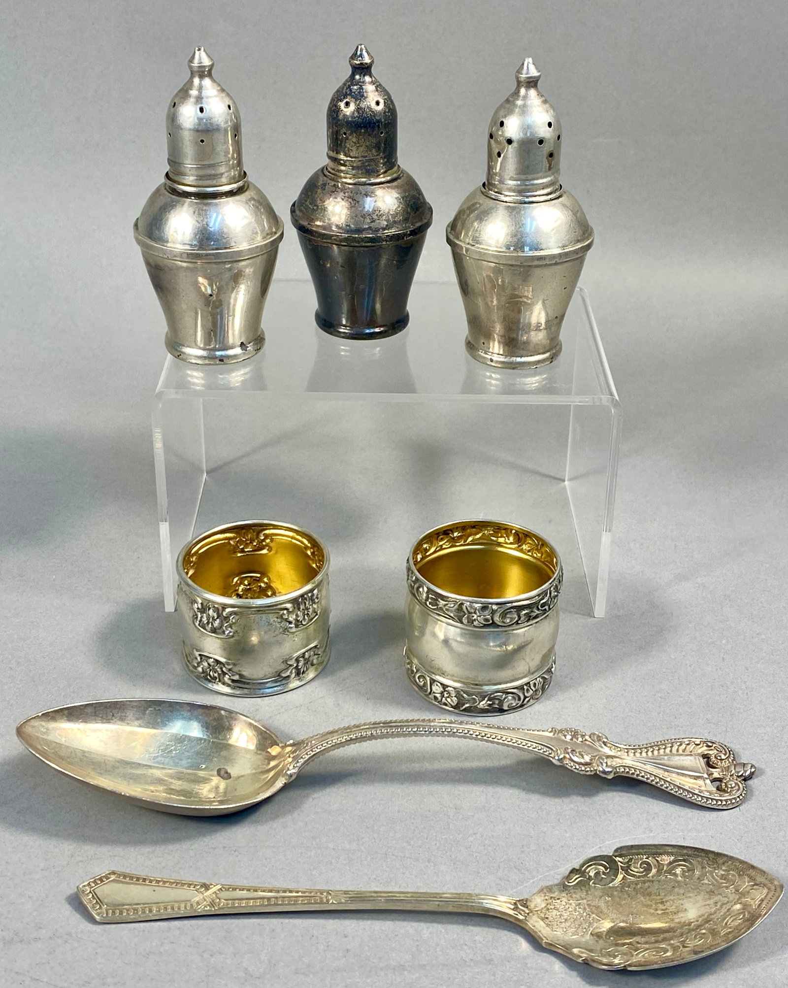 A Collection of Seven Pieces of Sterling Silver and Silver-Plated Tableware Including Gorham: This collection of seven pieces of silver tableware includes items of solid sterling silver and silver plate. A primary component is a Gorham Manufacturing Company berry spoon in the Strasbourg patter