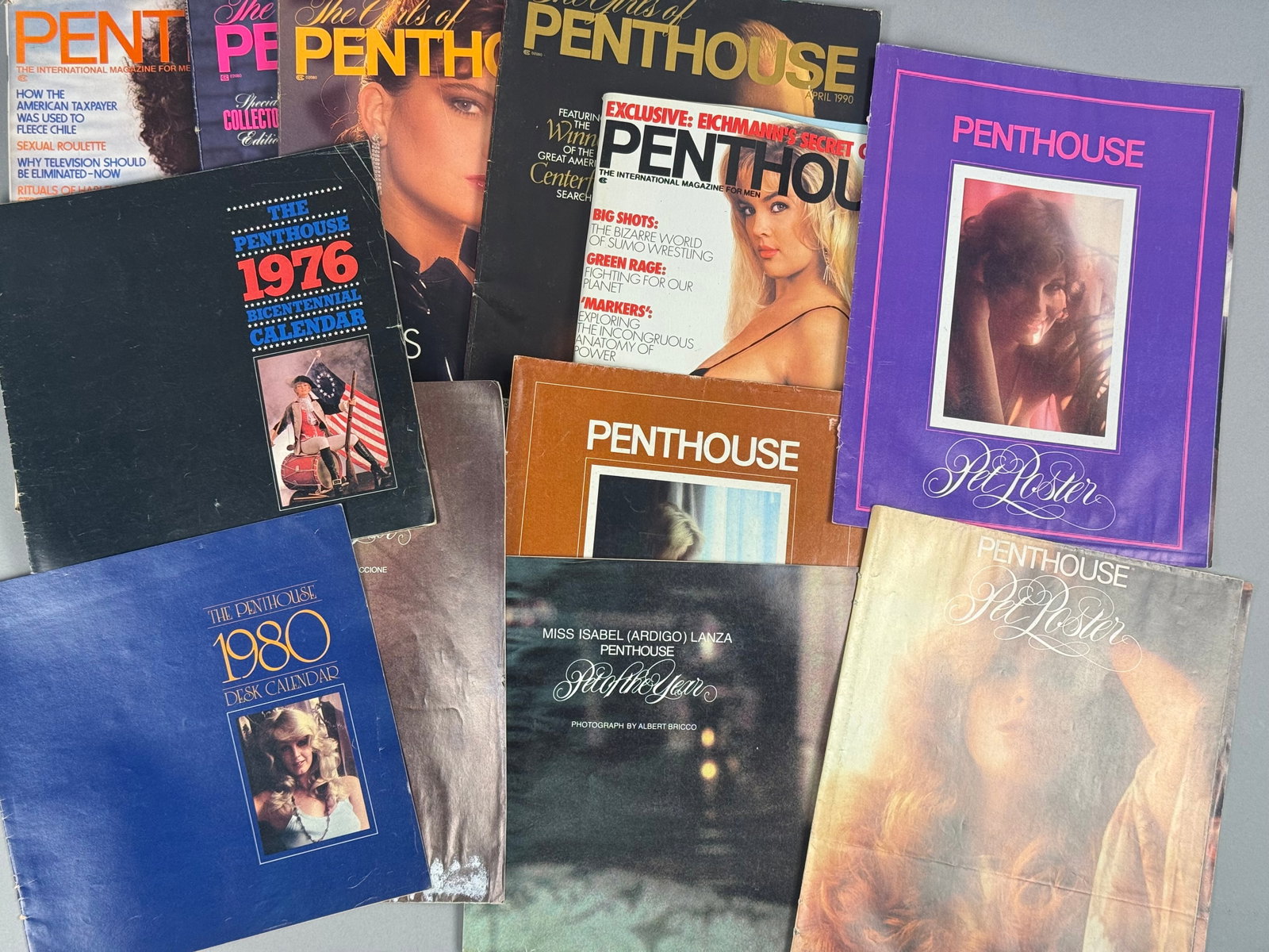 A Collection of Vintage Penthouse Magazines, Calendars, and Posters, 1976-1990: A collection of vintage publications and ephemera produced by Penthouse International Ltd., dating from the late 1970s through 1990. This lot includes a variety of media such as monthly magazines, spe