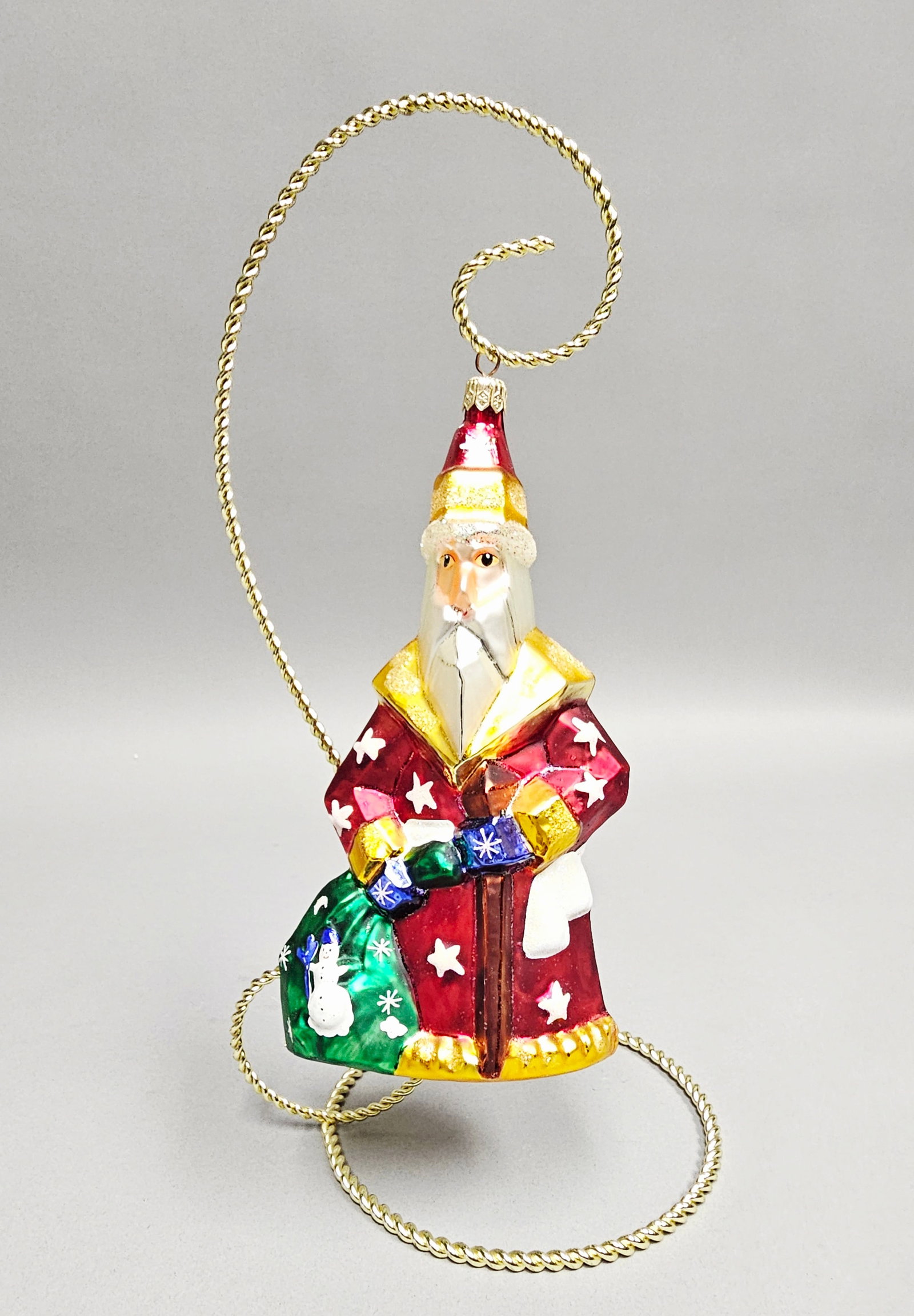 Christopher Radko Hand Painted Blown Glass Santa: Stand not included. A large hand-blown glass Christmas ornament depicting Wood Santa in a traditional folk-style robe. The item is in excellent condition with no visible chips, cracks, or repairs. Han