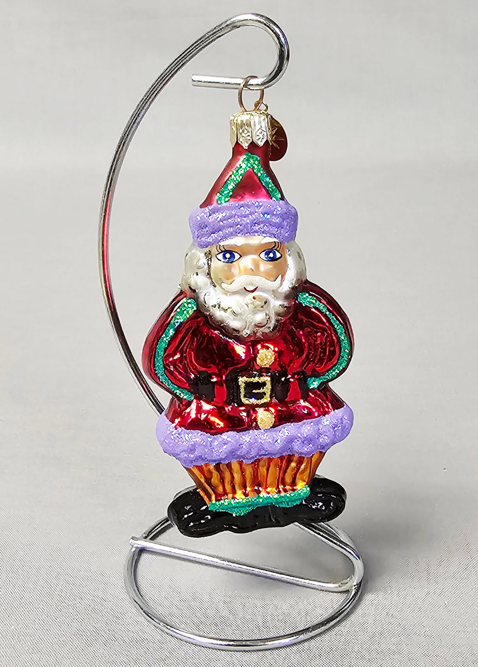 Christopher Radko Ginger Snap Santa Glass Ornament: Stand not included. This is a Christopher Radko hand-blown and hand-painted silvered glass Christmas ornament, identified as the Ginger Snap Santa Gem pattern. The ornament is in excellent condition, 