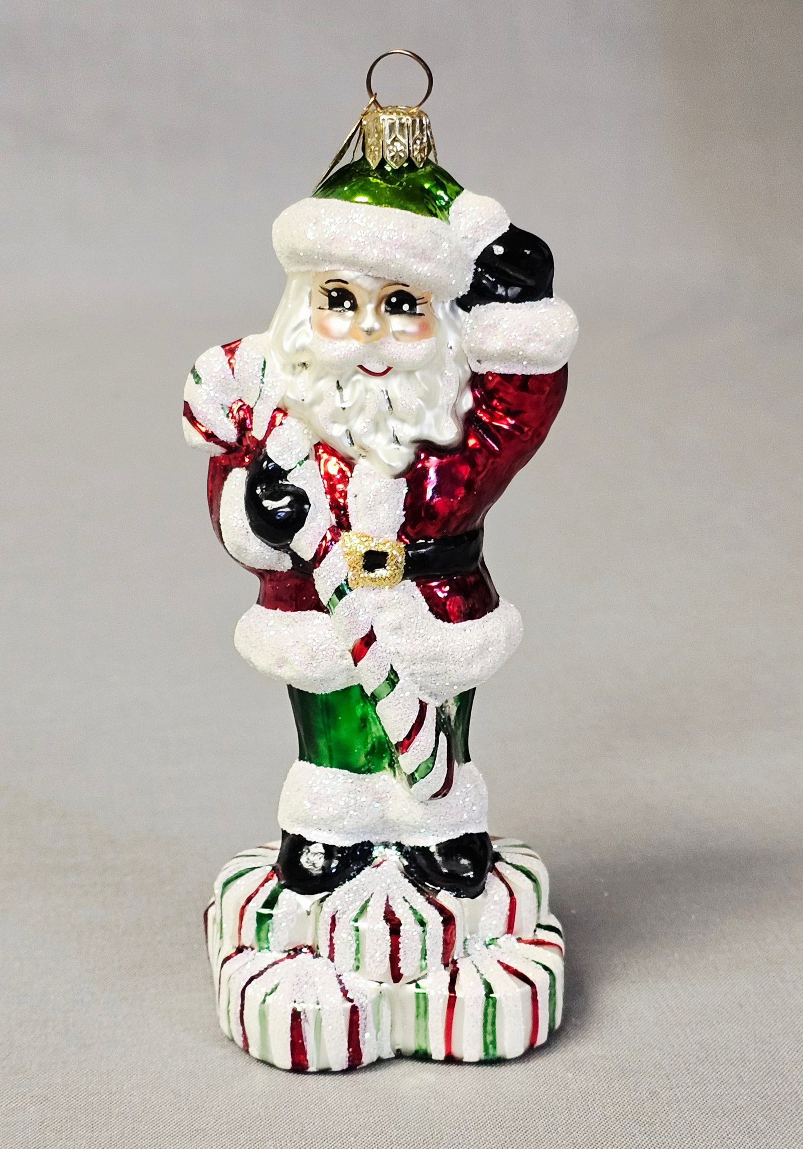 Christopher Radko Glass Santa Claus Ornament: Stand not included. A hand-blown and silvered glass Christmas ornament by Christopher Radko, depicting a standing Santa Claus. The ornament is in very good to excellent condition. There are no visible