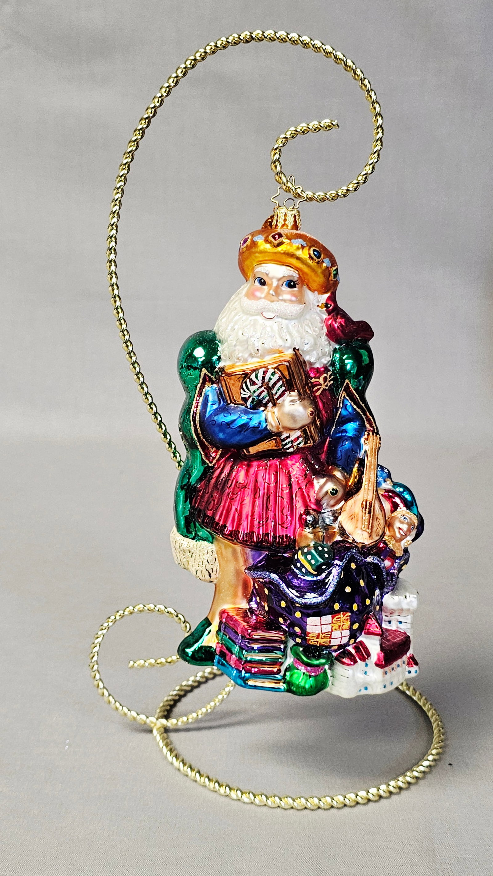 Christopher Radko St. Greensleeves Glass Christmas Ornament: Stand not included. This Christopher Radko hand-blown glass Christmas ornament is titled St. Greensleeves and is part of the Santa through the Centuries collection. Representing a 15th-century Italian