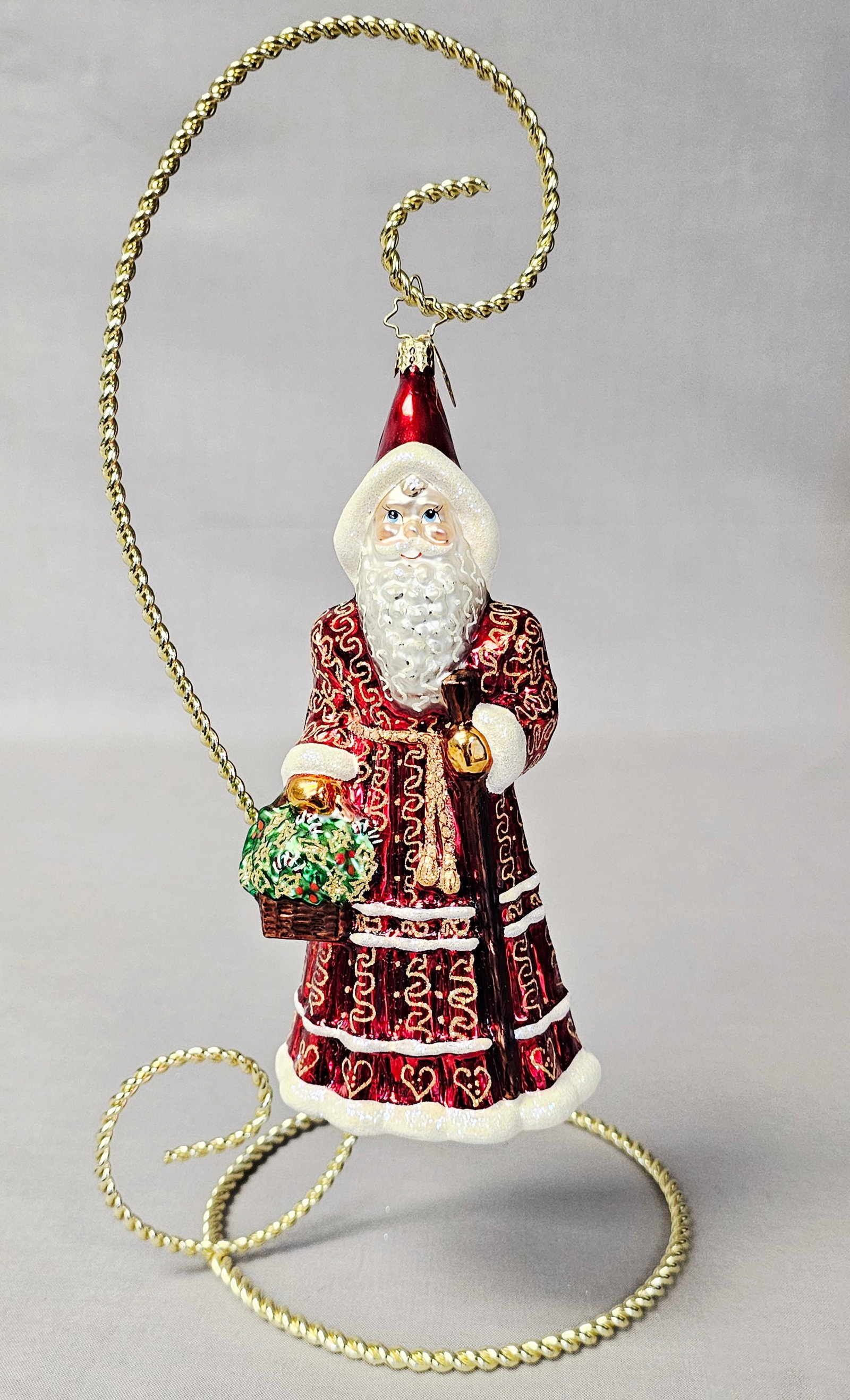 Christopher Radko Festive Santa Blown Glass Ornament: Stand not included. A mouth-blown glass Christmas ornament by Christopher Radko depicting a traditional Father Christmas or Santa Claus figure. This item is in very good condition. There are no visibl