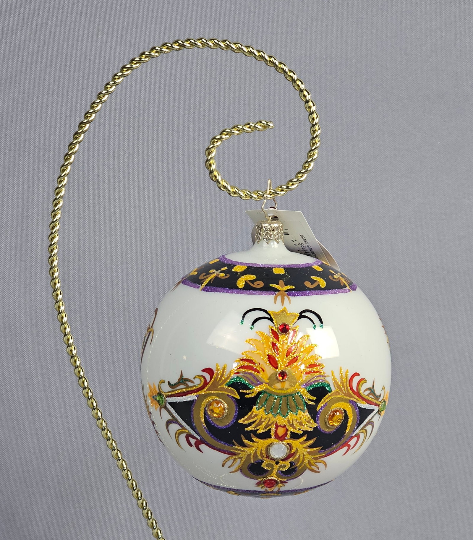 Christopher Radko 20th Anniversary St. Catherine's Crest Glass Ball Christmas Ornament, 2004: A Christopher Radko St. Catherine's Crest hand-painted glass ball Christmas ornament, produced in 2004 to commemorate the company's 20th anniversary. The large white glass ornament features intricate 
