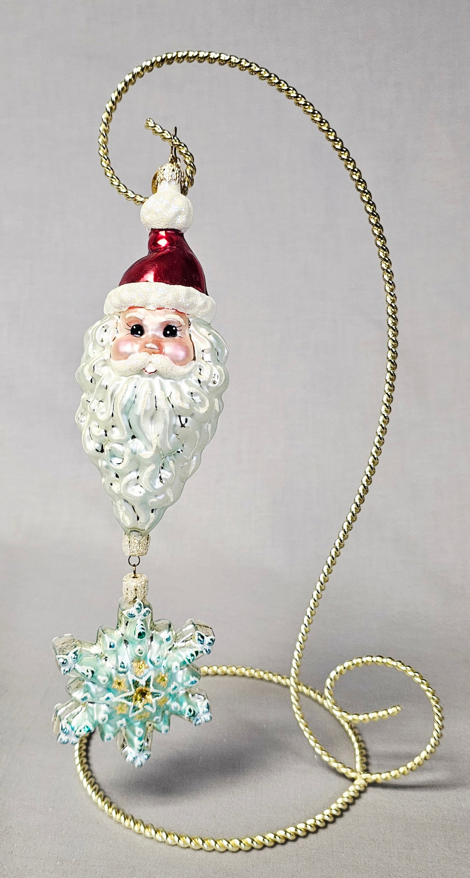 Christopher Radko Ho-Ho-Happy Year Santa Ornament: Stand not included. A mouth-blown and hand-painted glass Christmas ornament by Christopher Radko, identified as the Ho-Ho-Happy Year design. This double-drop ornament is constructed from silvered glas