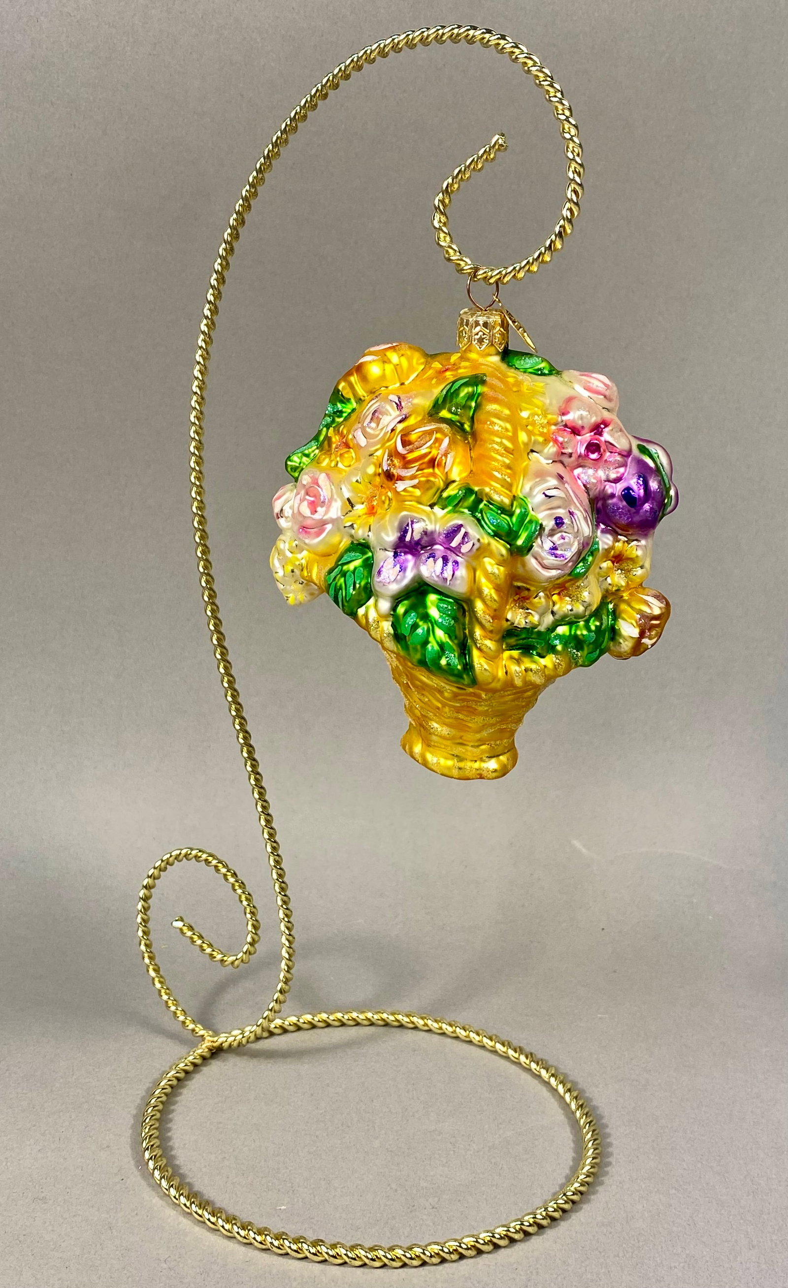 Radko Flower Power Breast Cancer Awareness Floral Basket Glass Ornament: This mouth-blown glass Christmas ornament is produced by Christopher Radko and titled Flower Power, released in support of breast cancer research. Hand-painted details are enhanced with iridescent gli