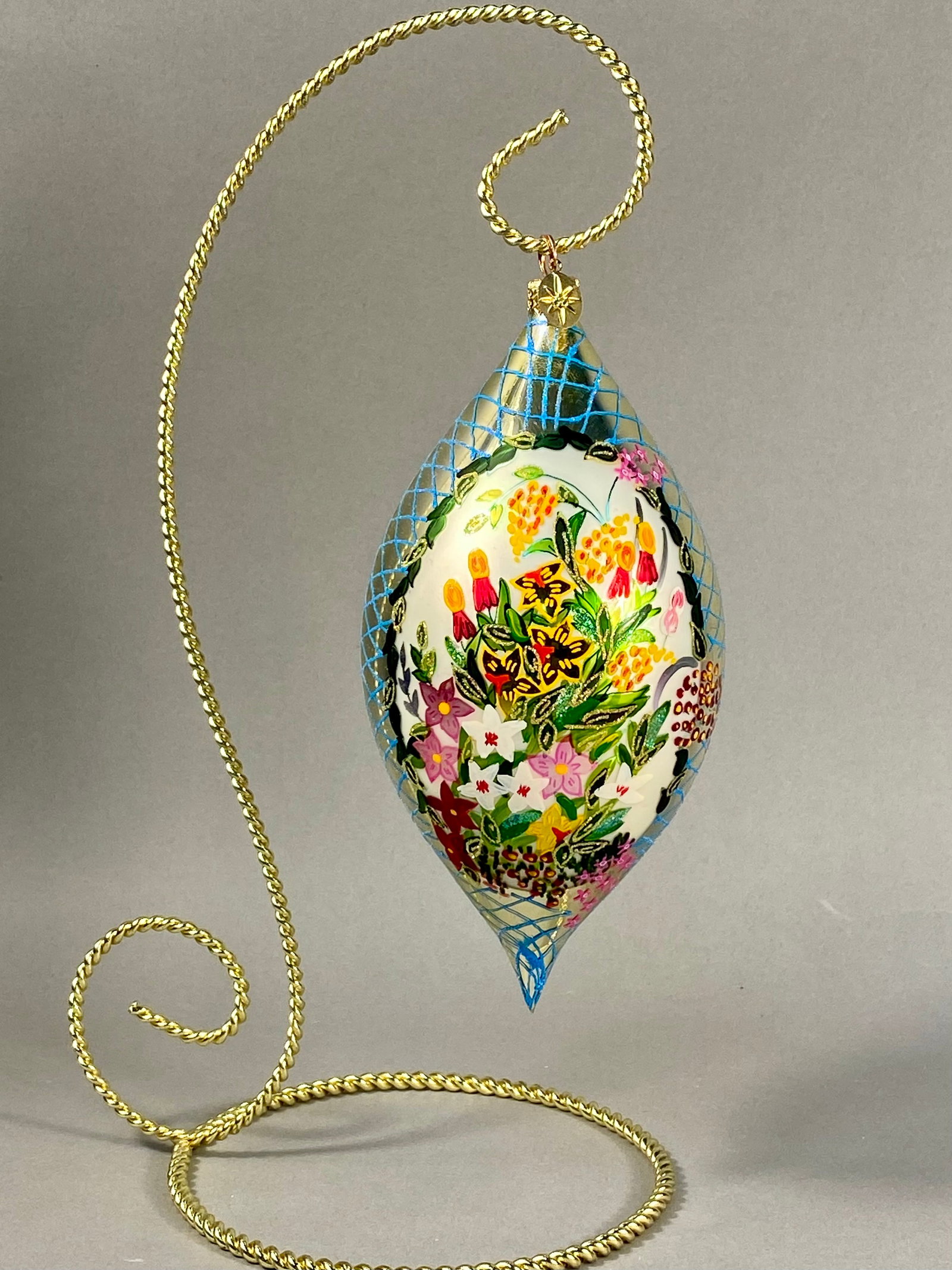 Radko Summer Garden Hand Painted Teardrop Ornament: This large blown glass ornament is identified as the Summer Garden pattern by Christopher Radko. The teardrop-shaped piece features a central horizontal band of opaque white glass decorated with intri
