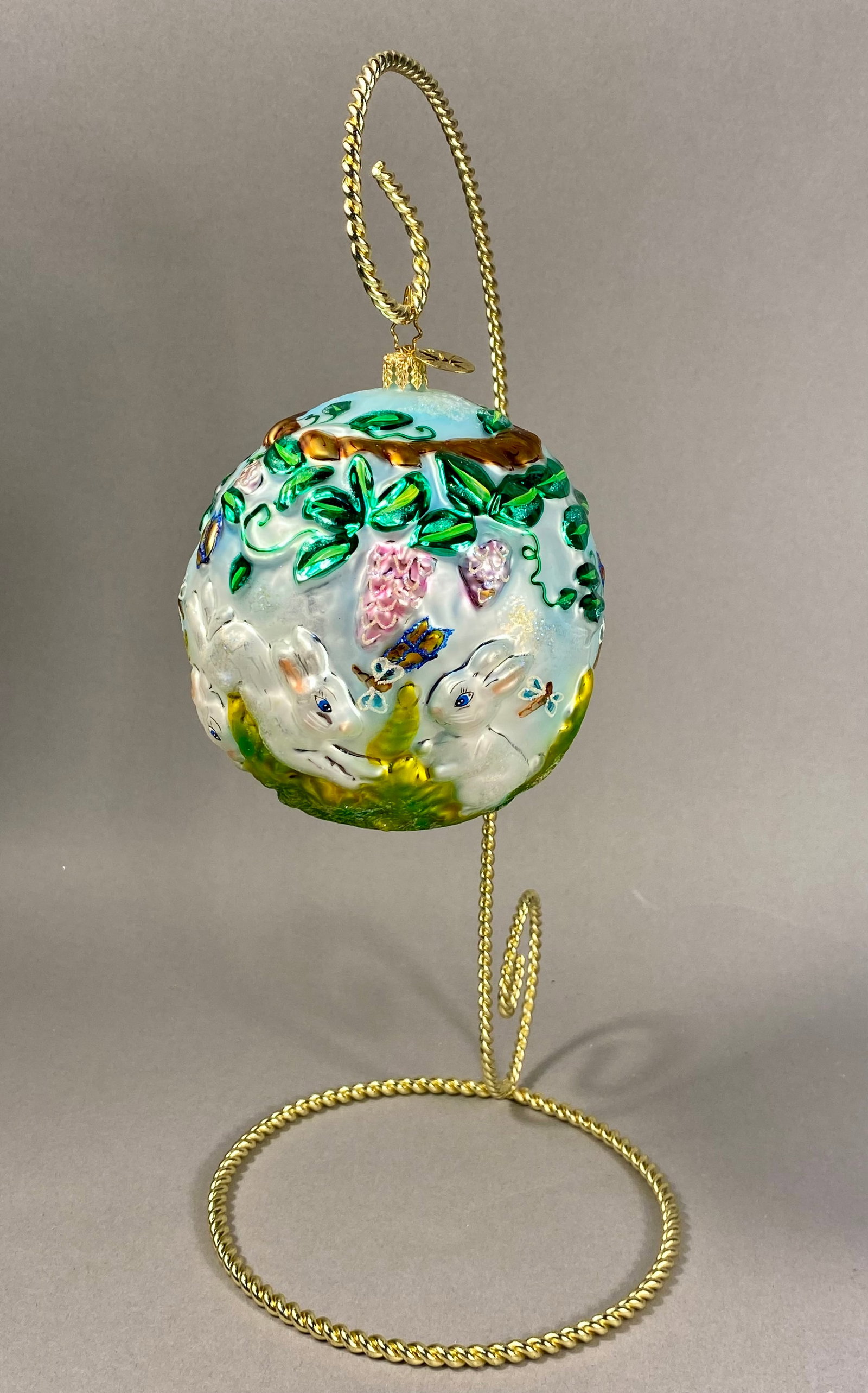 Radko Fern Meadows Mouth-Blown Glass Ball: A Christopher Radko mouth-blown glass ornament featuring the Fern Meadows pattern. This spherical ornament is hand-painted and detailed with molded relief elements and iridescent glitter accents. The 