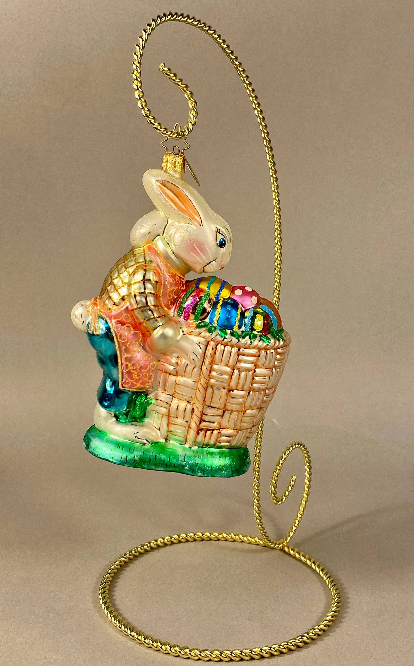 Christopher Radko Hand-Blown Glass Roy Rabbit Easter Bunny Ornament: A Christopher Radko hand-blown figural glass ornament, identified as the Roy Rabbit model. This silvered glass piece depicts an Easter bunny standing on a grassy green base. The rabbit is shown in pro