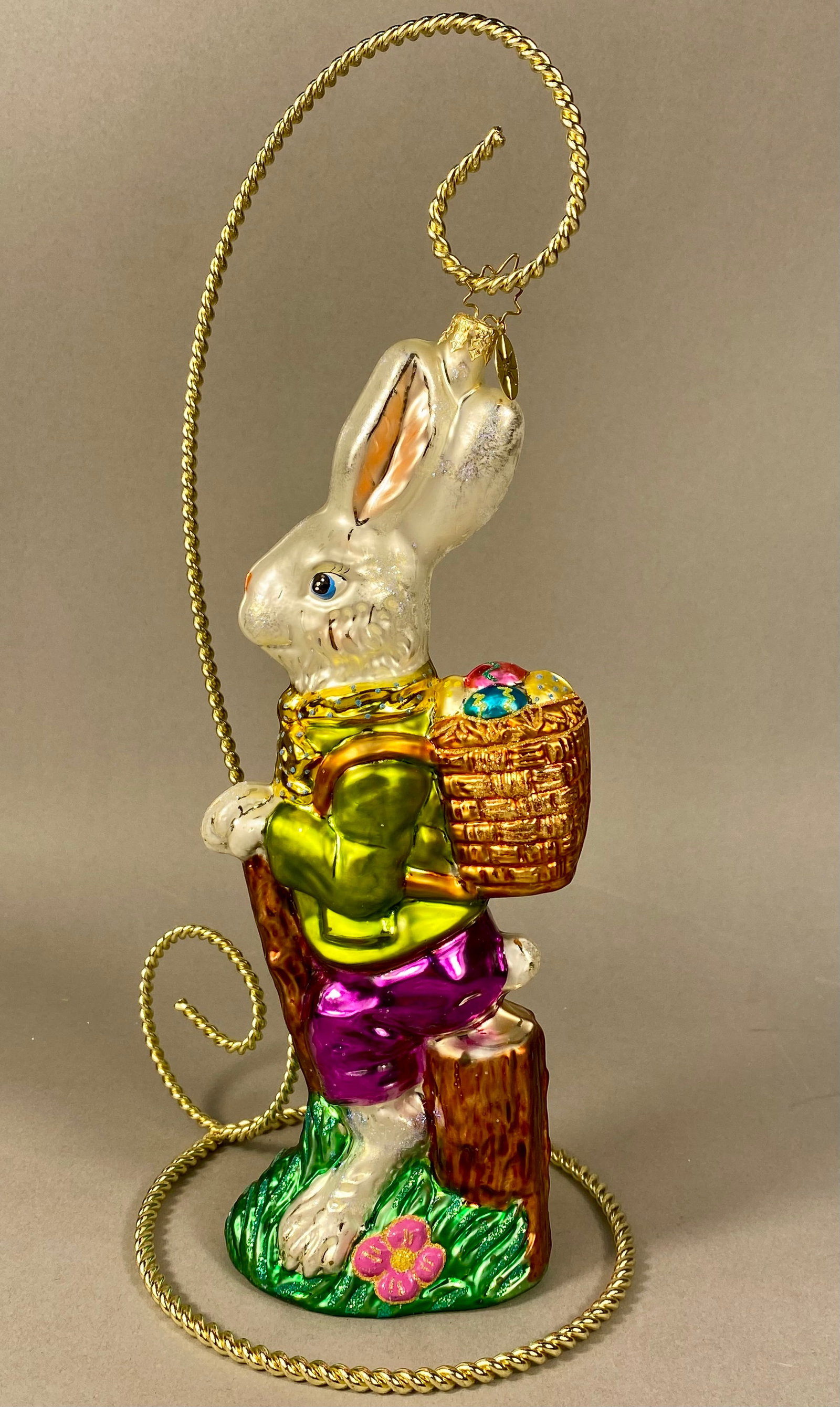 Christopher Radko Roy Rabbit Large Hand-Painted Blown Glass Easter Ornament: This large hand-blown glass ornament is identified as Roy Rabbit from the Christopher Radko holiday collection. The piece features an anthropomorphic Easter bunny portrayed in a walking stance, leanin