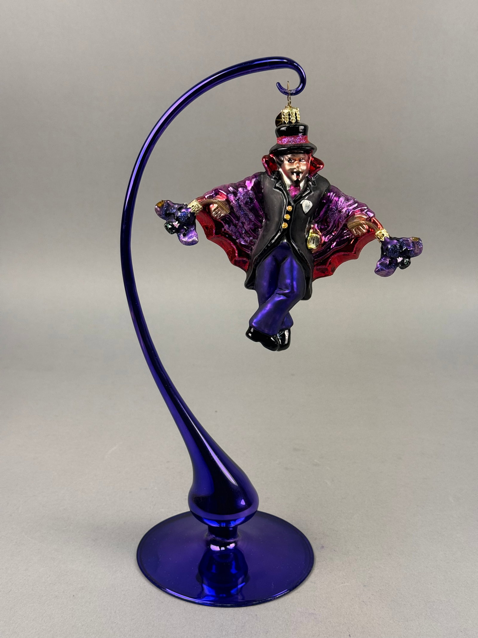 Radko Blown Glass Dracula Vampire Christmas Ornament: A mouth-blown glass Christmas ornament produced by Christopher Radko, depicting a theatrical vampire character. The ornament is finished with a gold-toned metal cap and the signature Christopher Radko