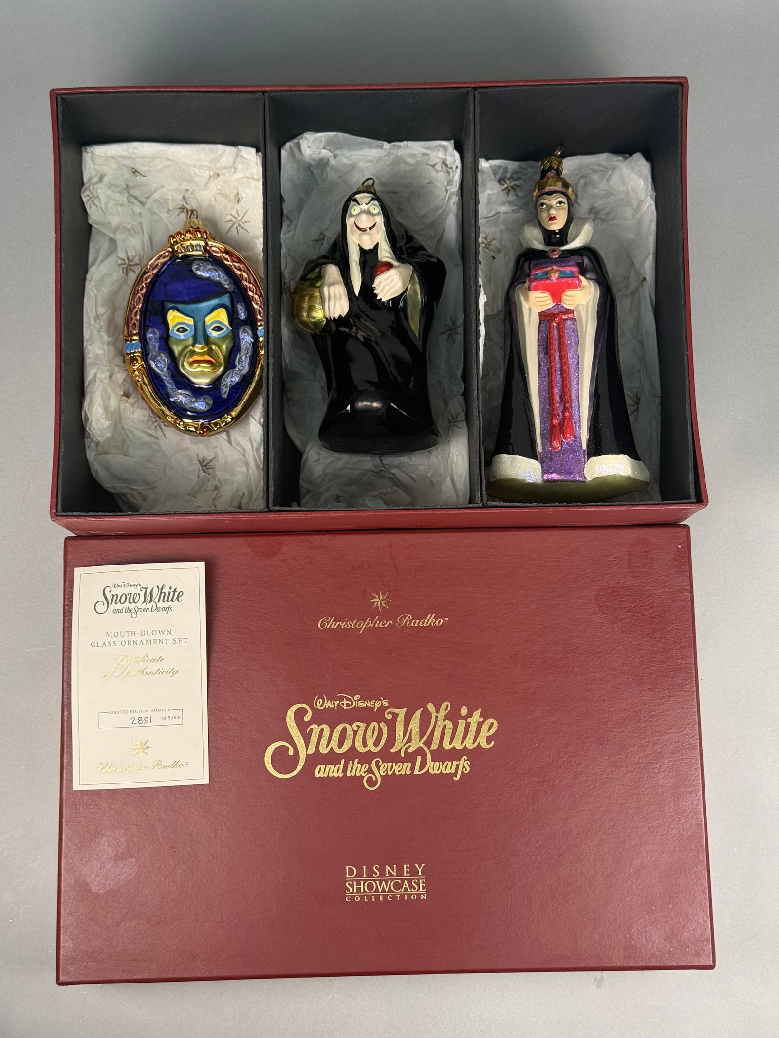 Radko Disney Showcase Collection Snow White Trio of Blown Glass Ornaments: A limited edition set of three mouth-blown glass Christmas ornaments from the Disney Showcase Collection, designed by Christopher Radko to commemorate Walt Disneyâ€™s animated classic Snow Whi