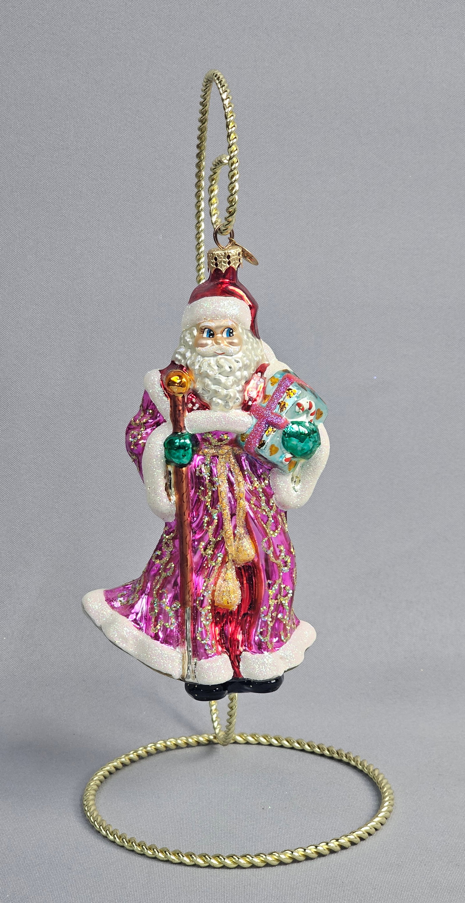 Christopher Radko Blown Glass Santa Claus Christmas Ornament: A hand-blown glass Christmas ornament by Christopher Radko. This large figure depicts a traditional Santa Claus dressed in a vibrant magenta-purple robe decorated with intricate scrolling gold-tone gl